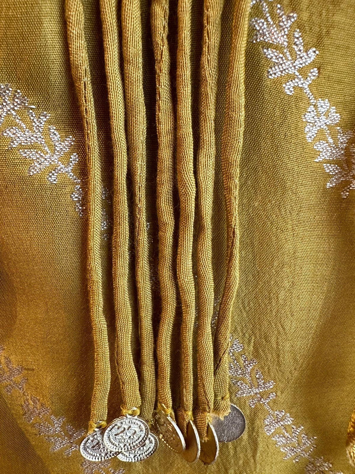 Silk shirt unstitched with very beautiful thread embroidered neck patti and designer Latkans with coin design