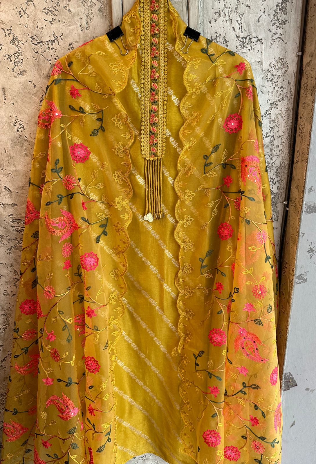 Silk shirt unstitched with very beautiful thread embroidered neck patti and designer Latkans with coin design