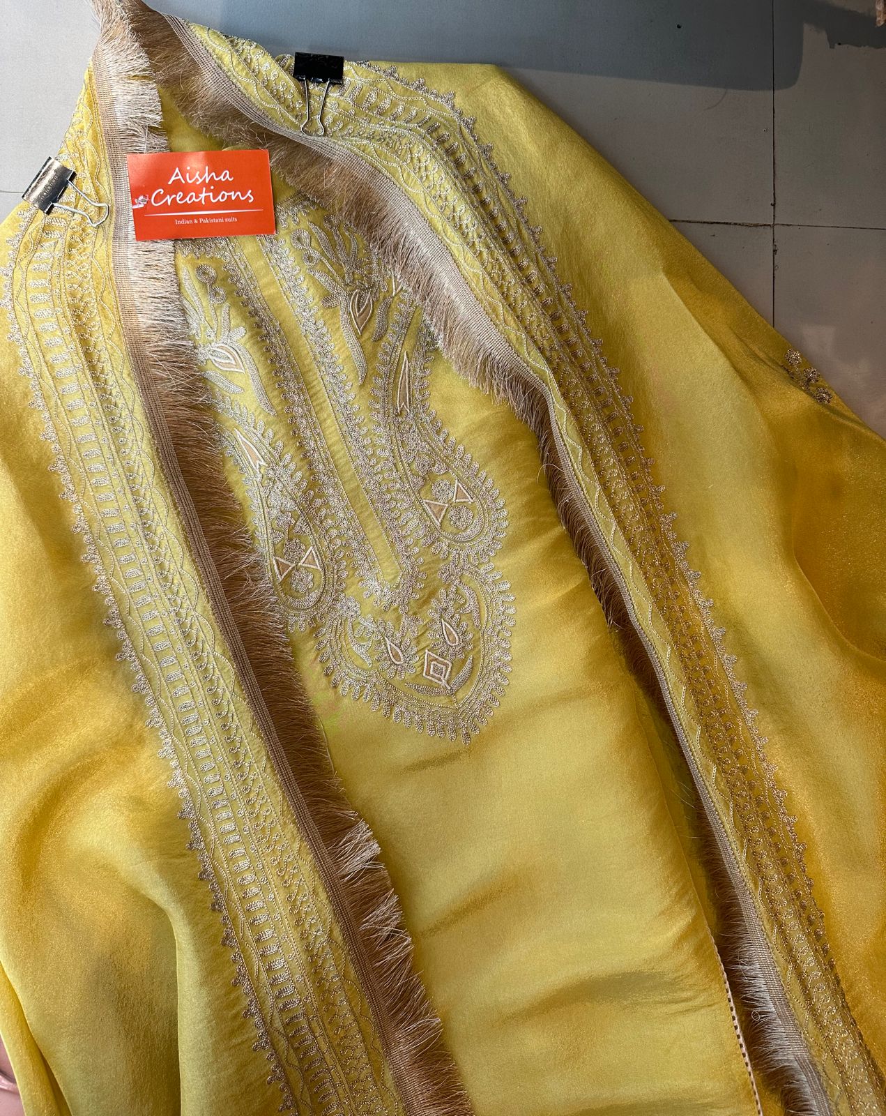 Pure tissue jacquard unstitched shirt with super beautiful gold zari work done the neckline And on the sides of the shirt