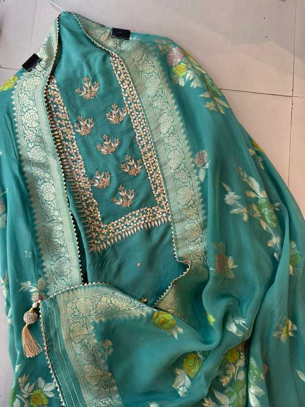 Pure mulberry silk shirt with very beautiful sequence dabka and gotta work on the neckline