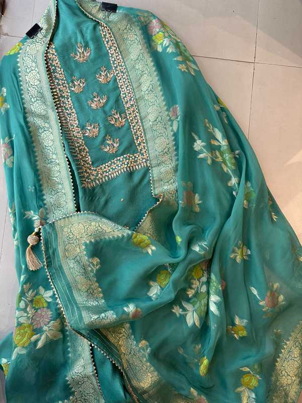 Pure mulberry silk shirt with very beautiful sequence dabka and gotta work on the neckline