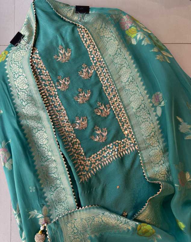 Pure mulberry silk shirt with very beautiful sequence dabka and gotta work on the neckline