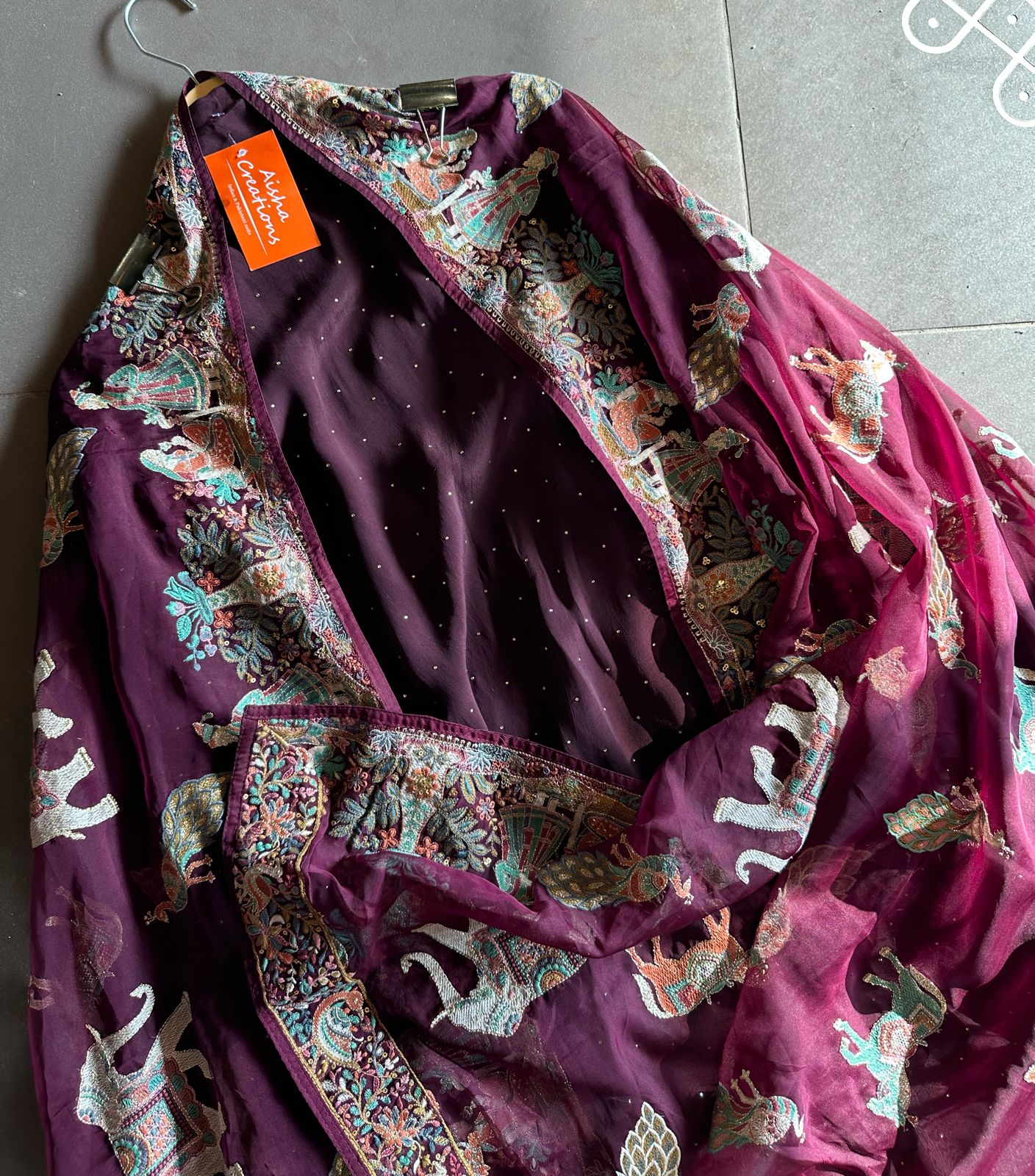 Pure Crepe silk shirt with complete swaroski highlights and a beautiful thread embroidered border