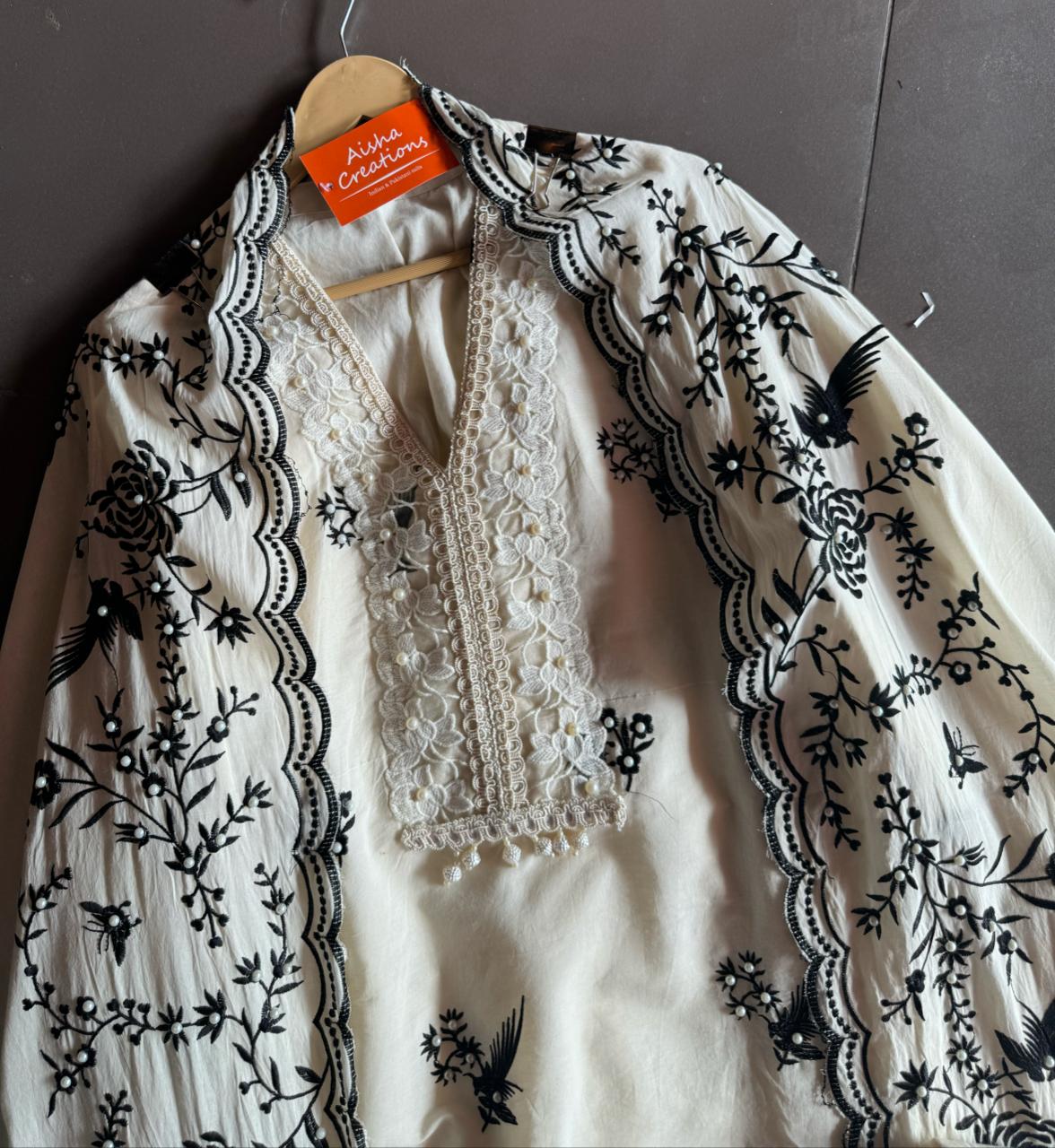 Pure cotton stitched shirt with a combination of hand and machine embroidery