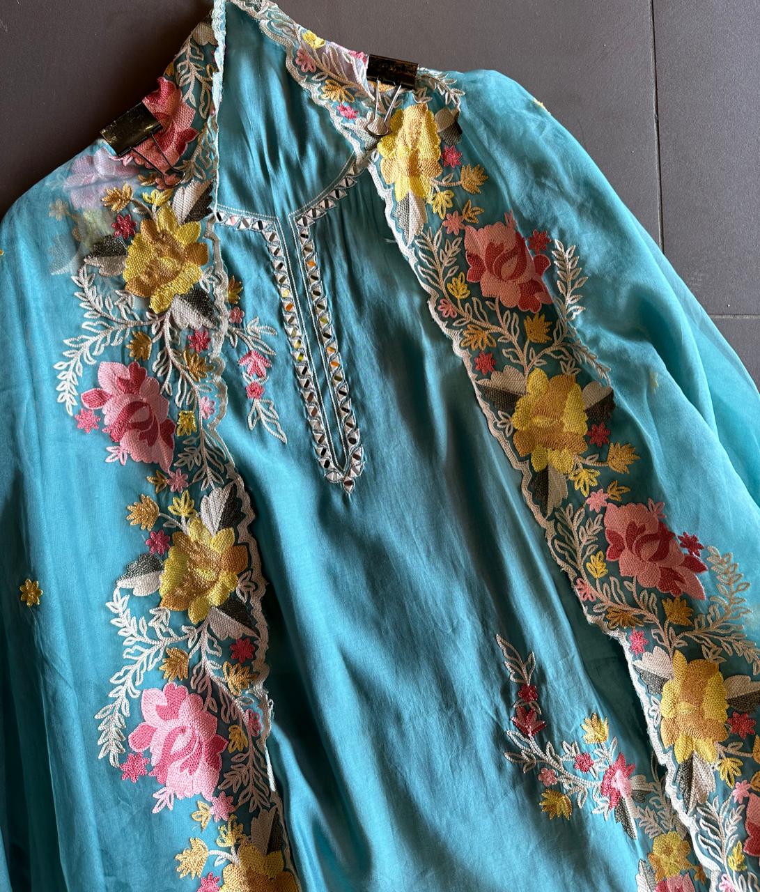 Soft cotton muslin shirt with mirror work  embroidery done on the neckline