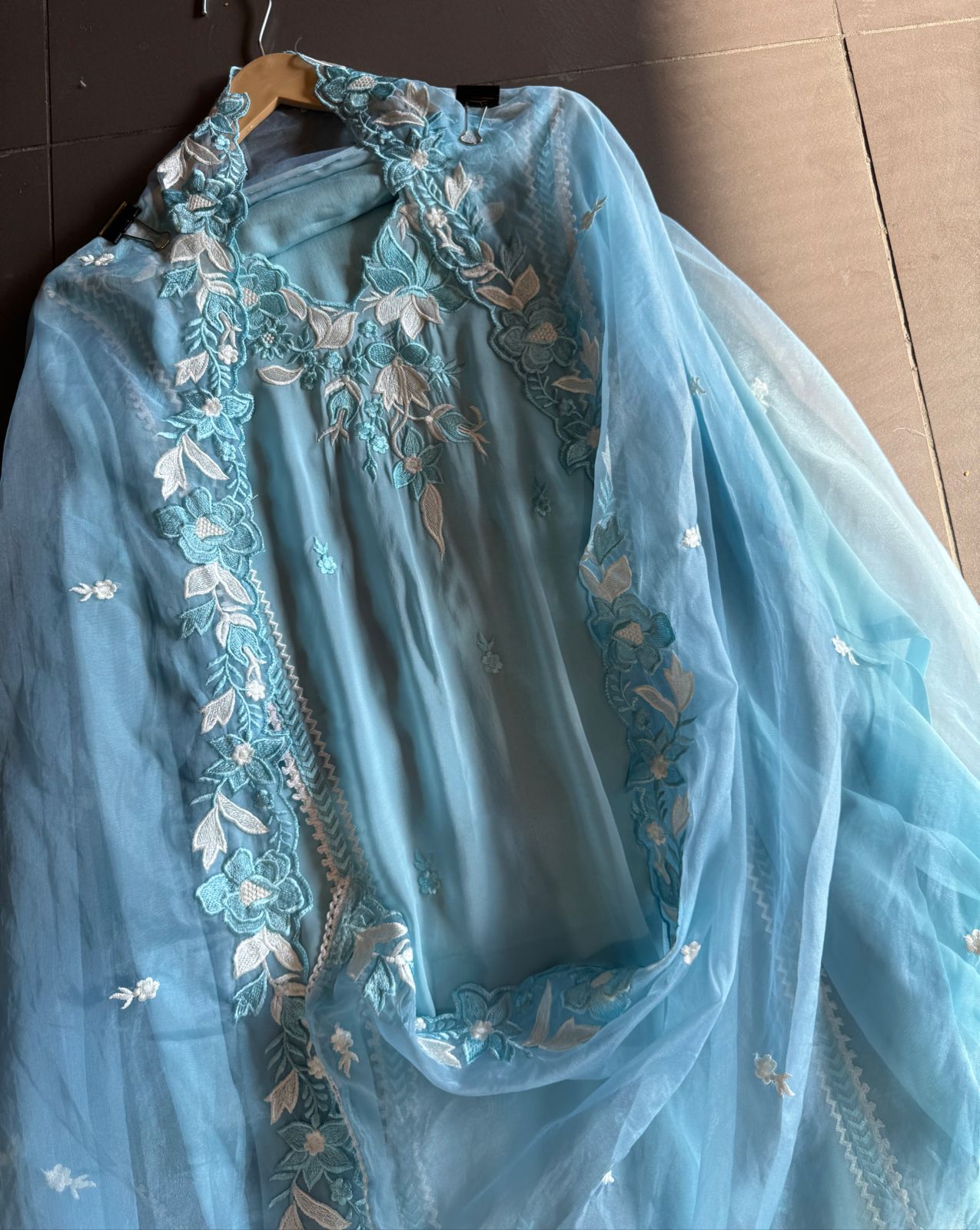 Soft organza shirt semi stitched with beautiful floral thread embroidery concept on the necklin