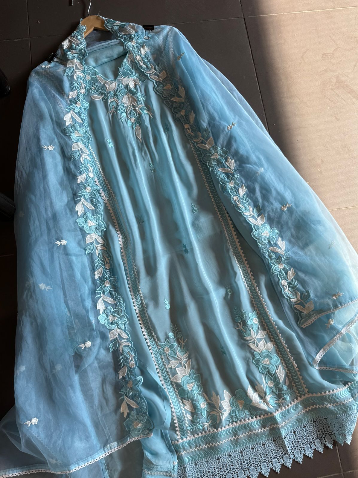 Soft organza shirt semi stitched with beautiful floral thread embroidery concept on the necklin