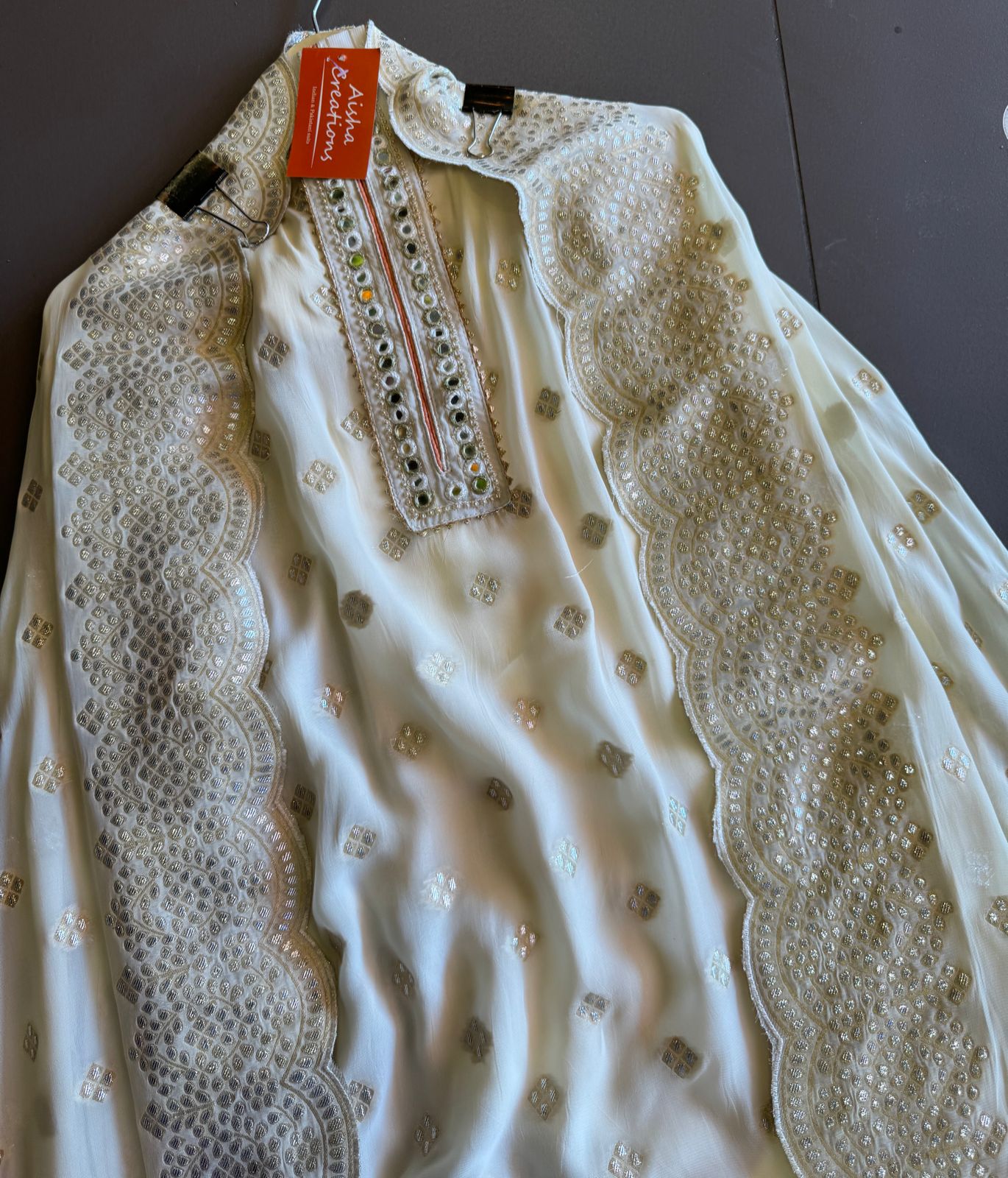 Pure banarsi Georgette shirt with overall zari booties with very beautiful neckline with mirror work done.