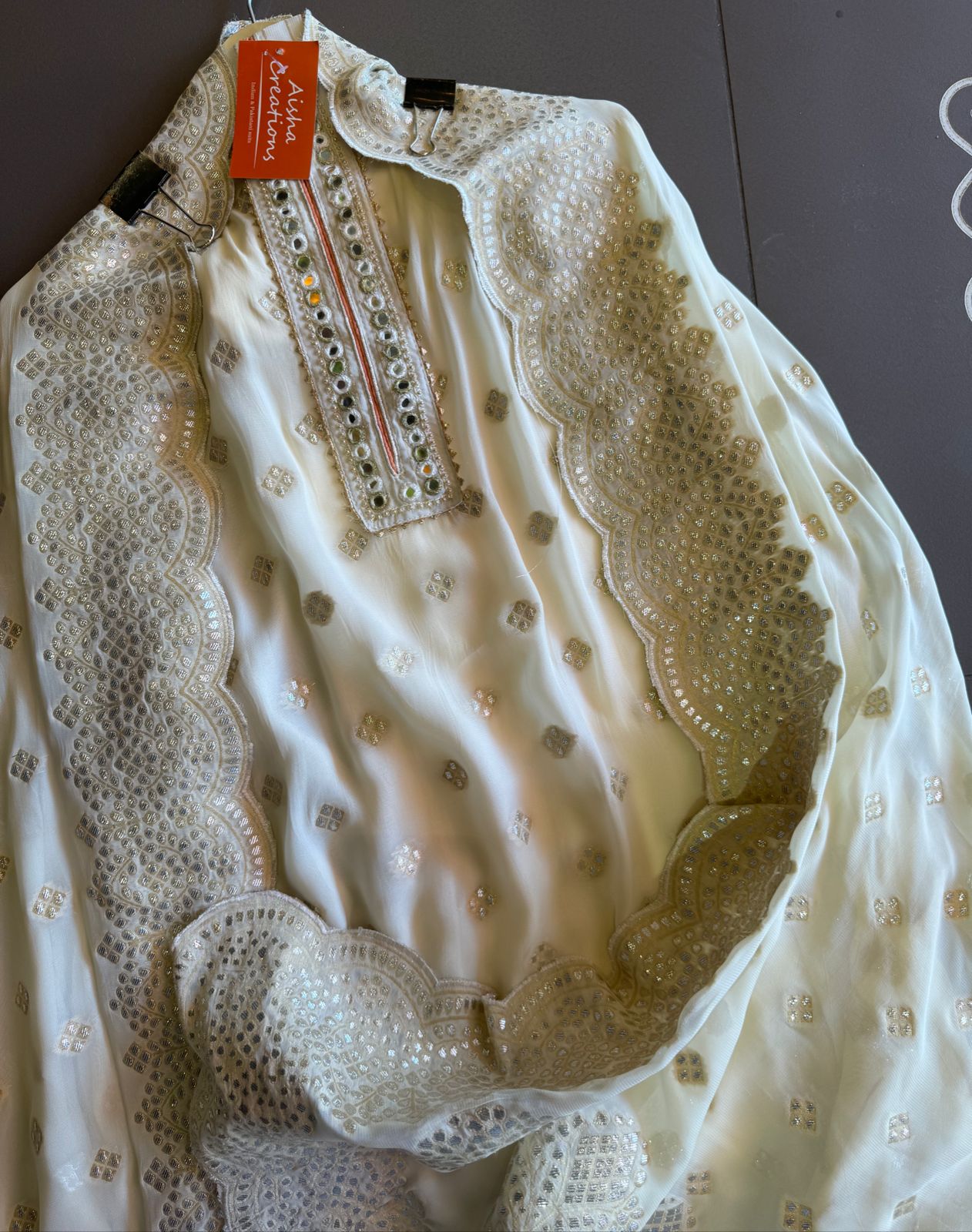Pure banarsi Georgette shirt with overall zari booties with very beautiful neckline with mirror work done.