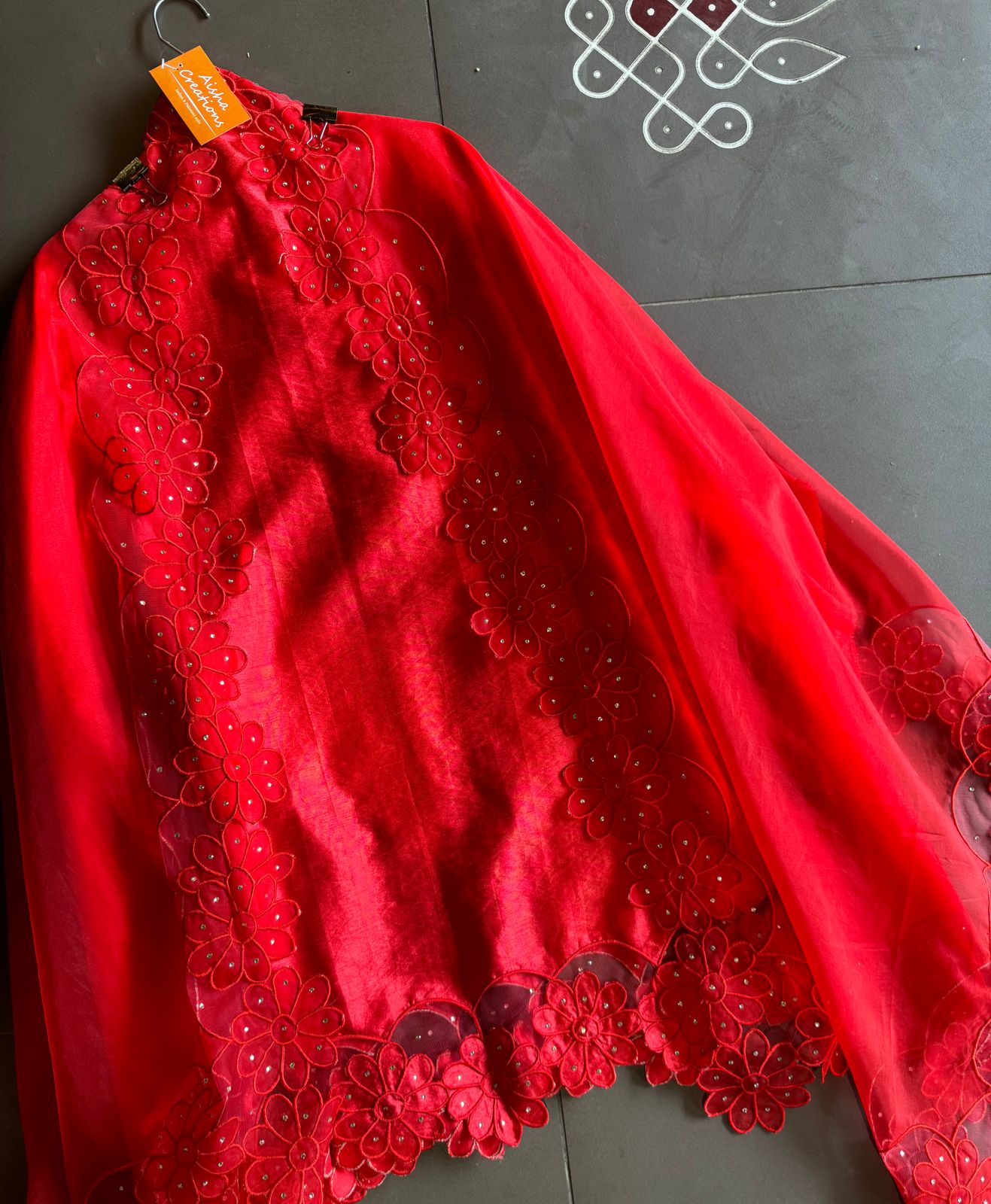 Red in colour With very smart Cutwork flower design with stone work highlighting.