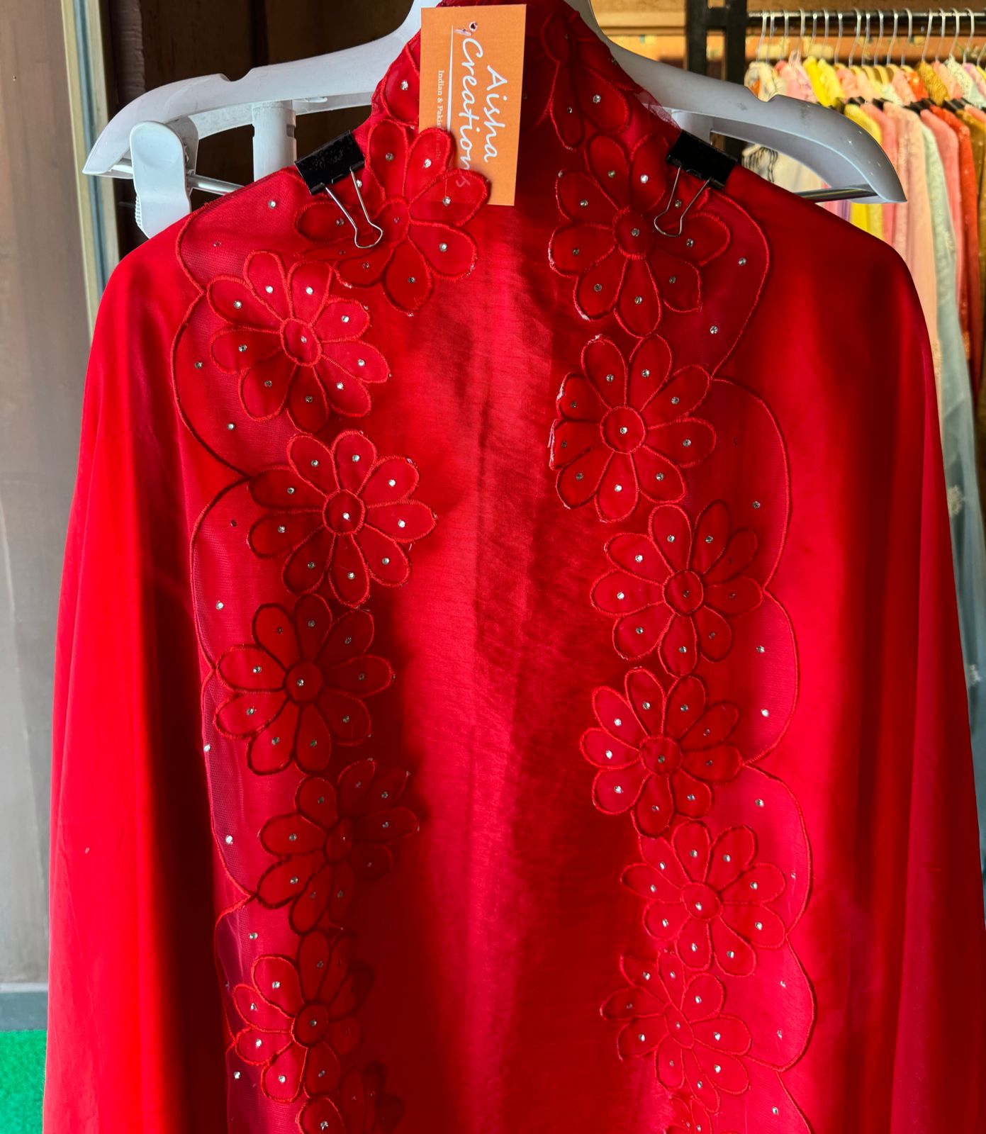 Red in colour With very smart Cutwork flower design with stone work highlighting.