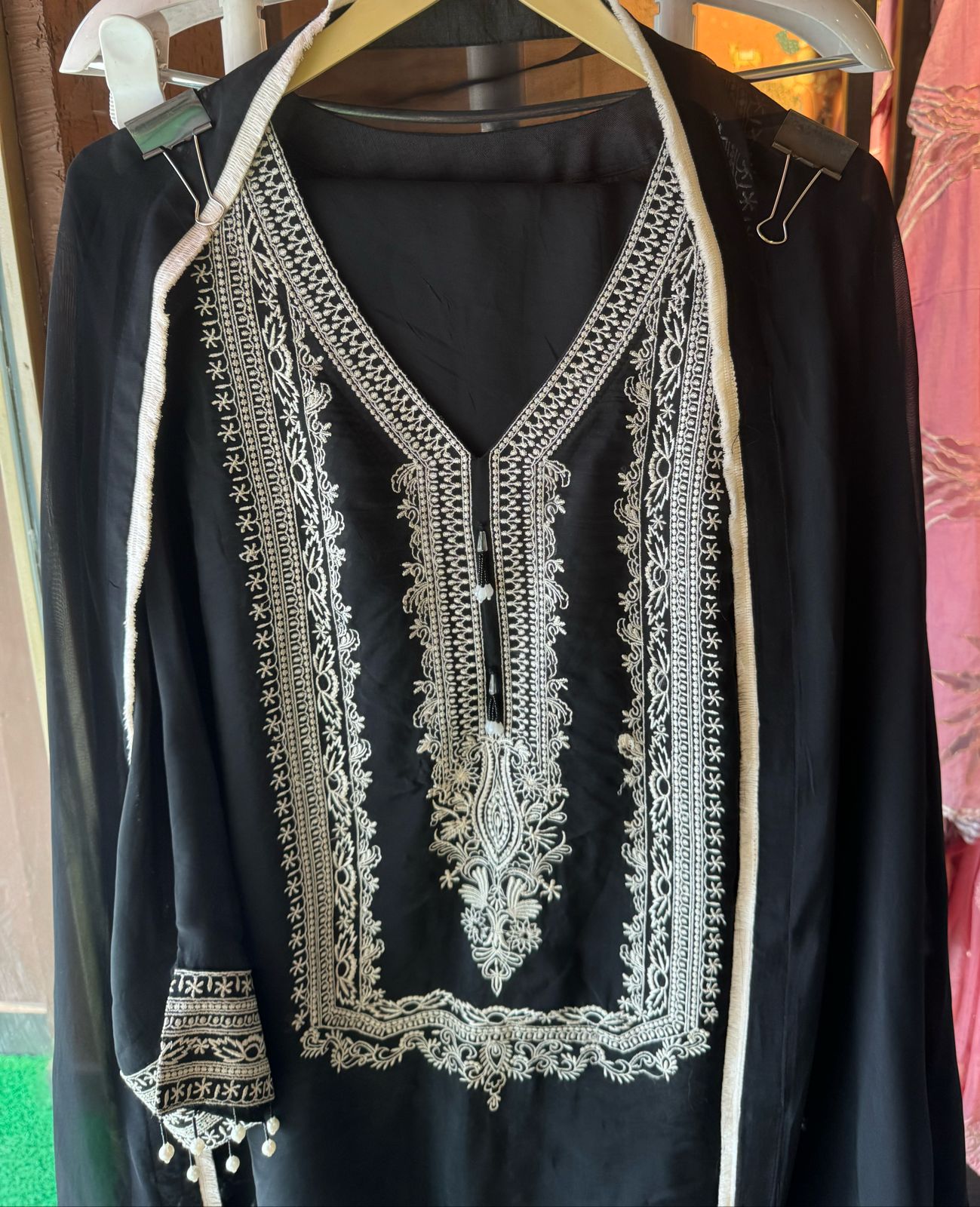 Soft flowy organza shirt with very smart and elegant thread work done on the neckline