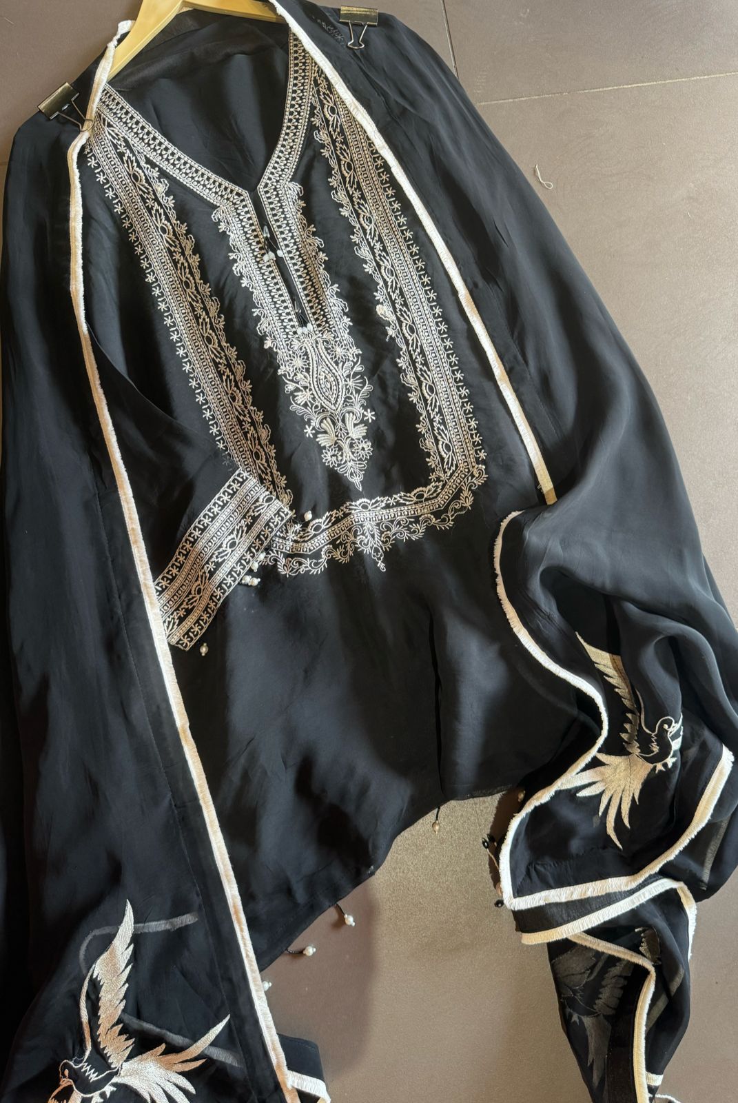 Soft flowy organza shirt with very smart and elegant thread work done on the neckline