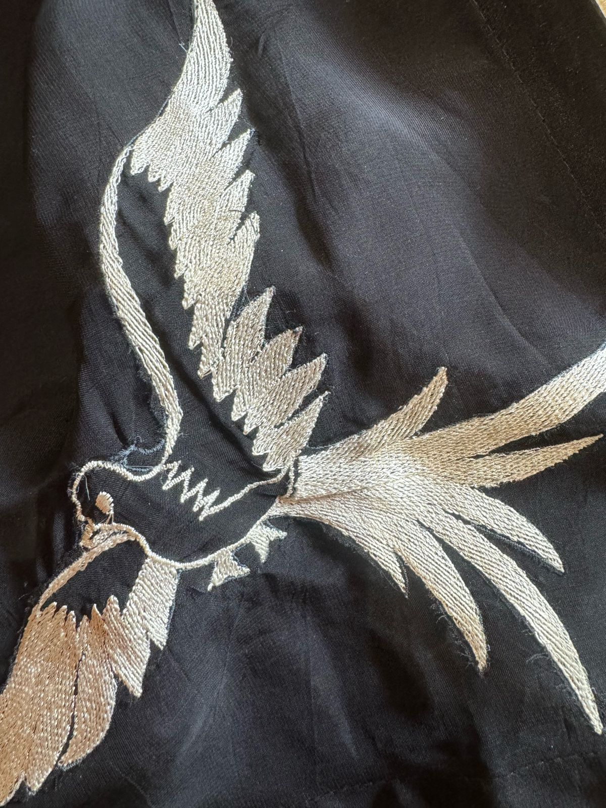 Soft flowy organza shirt with very smart and elegant thread work done on the neckline