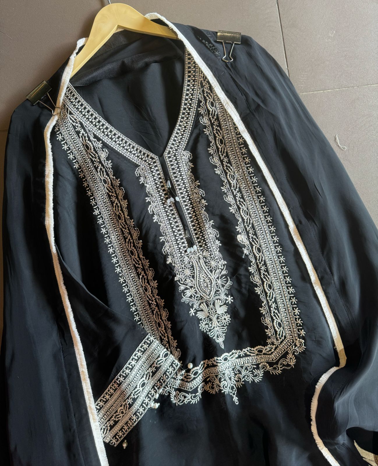 Soft flowy organza shirt with very smart and elegant thread work done on the neckline