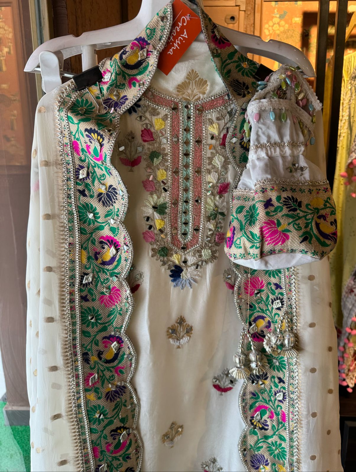 Beautiful silk shirt with heavy Neckwork with thread, mirror and zari work done