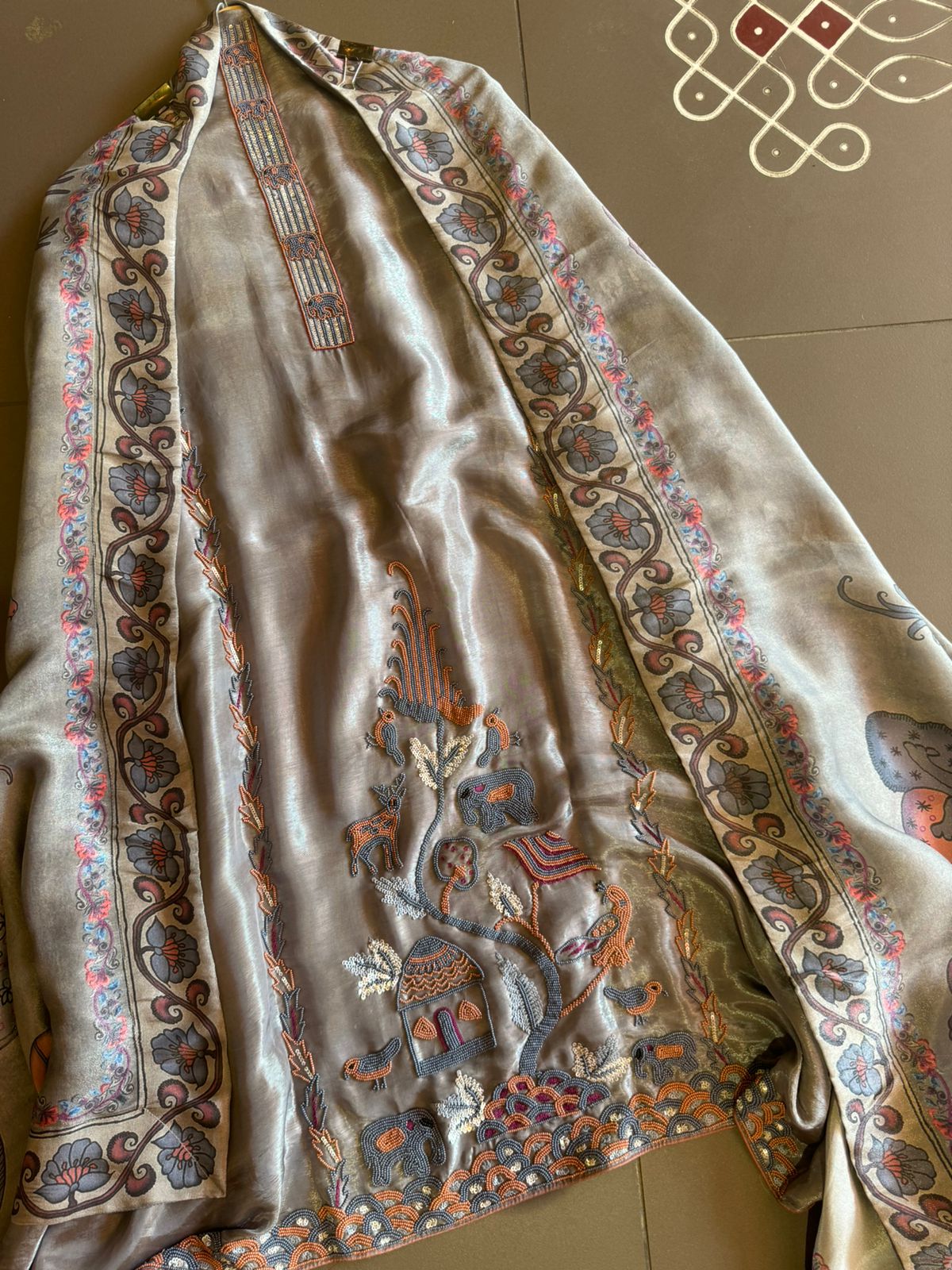 Soft tissue Unstitched Shirt With very Neat handwork done on the neck Patti and The shirt front.