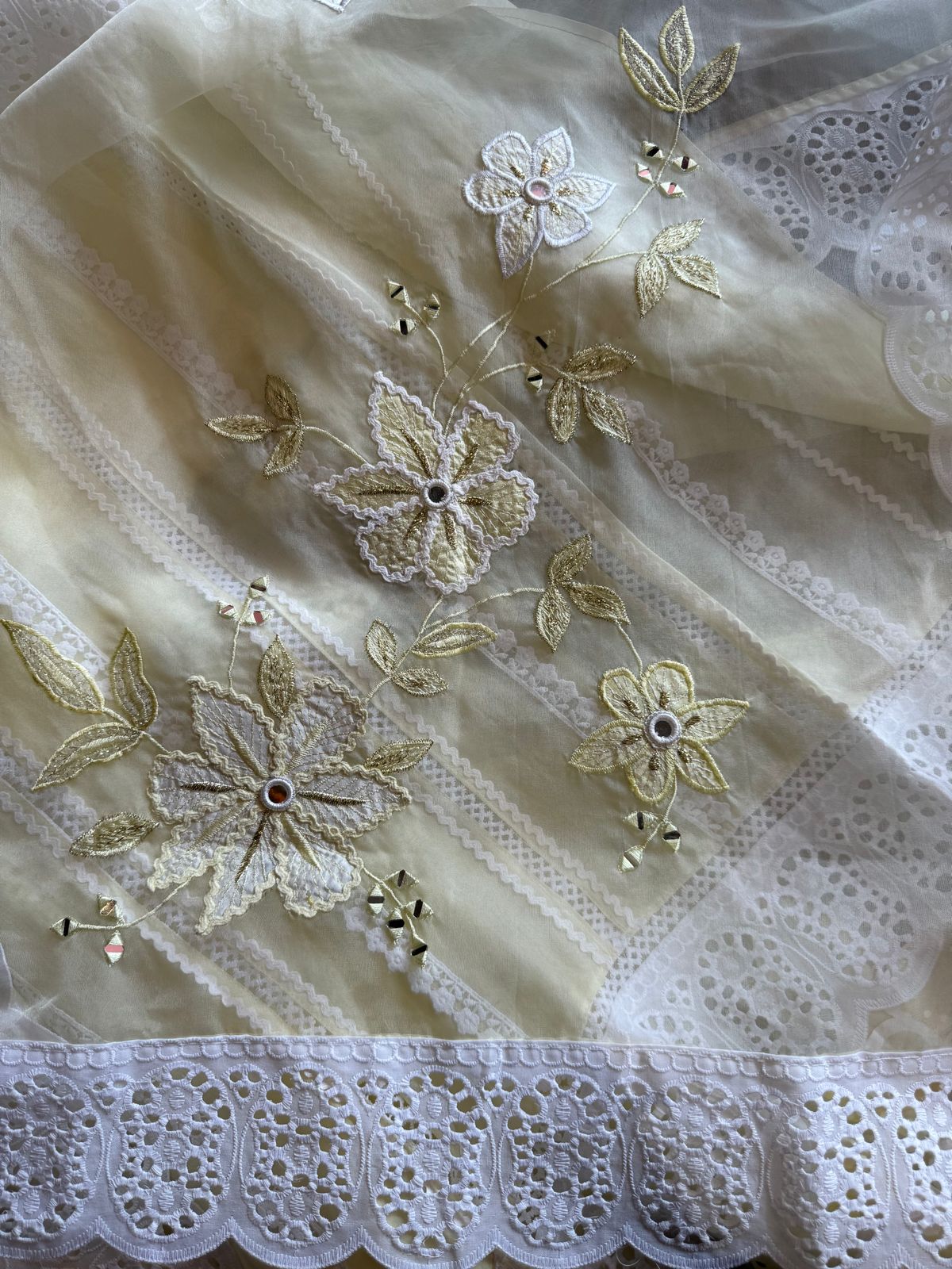 Soft organza unstitched suits with heavy crochia lace work detailings on the shirt