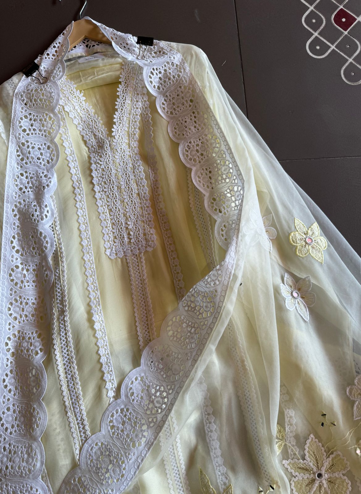 Soft organza unstitched suits with heavy crochia lace work detailings on the shirt