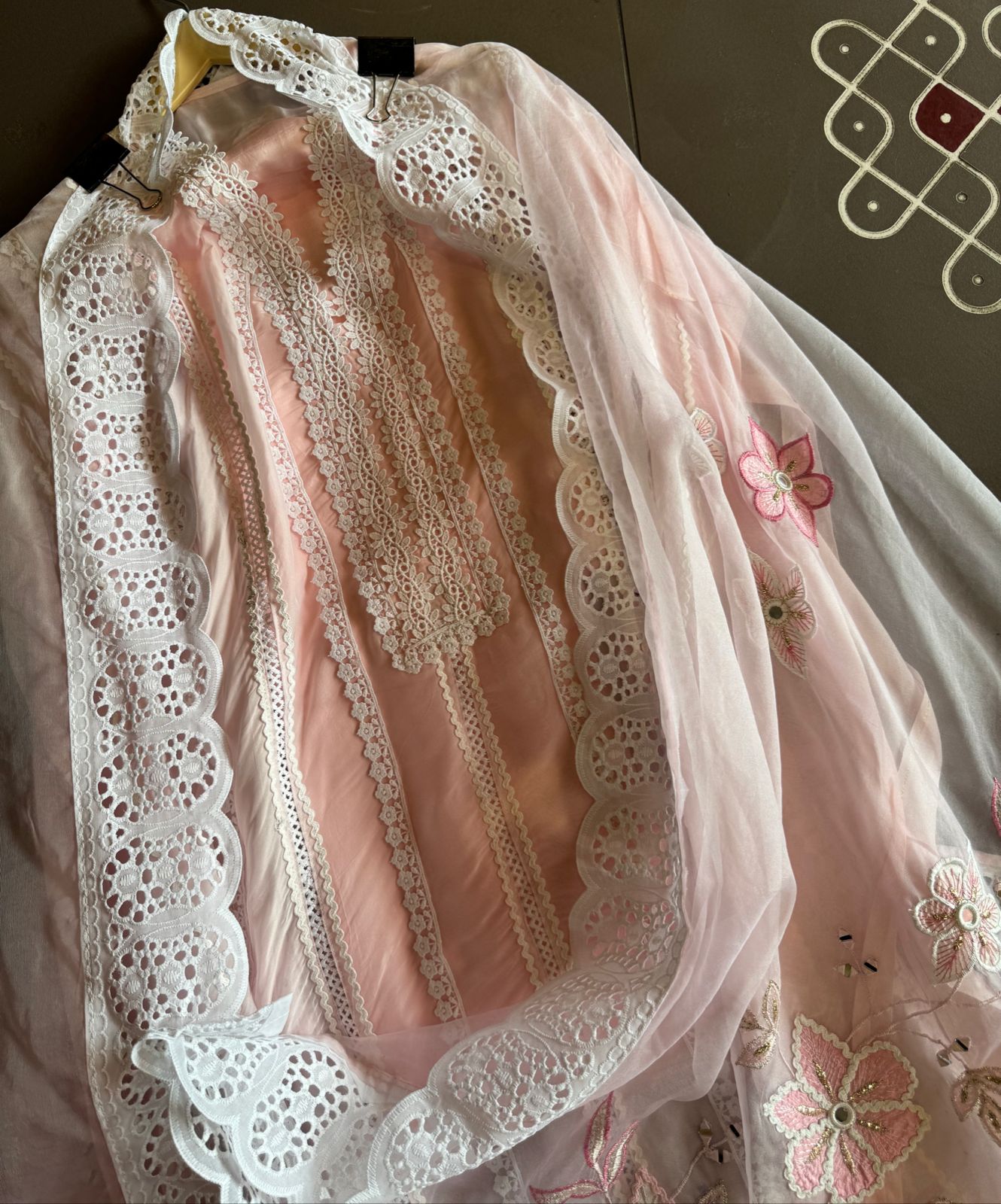 Soft organza unstitched suits with heavy crochia lace work detailings on the shirt