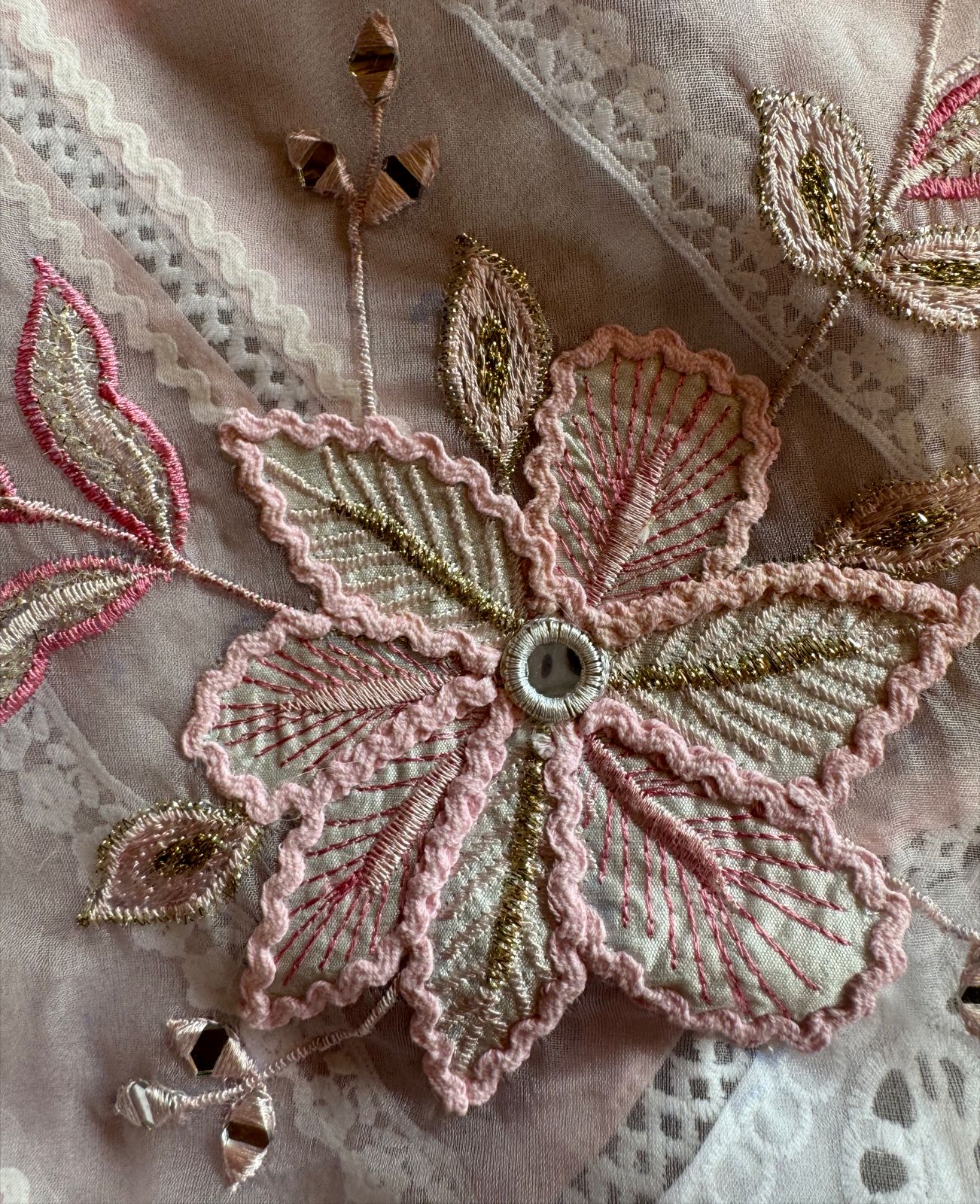 Soft organza unstitched suits with heavy crochia lace work detailings on the shirt