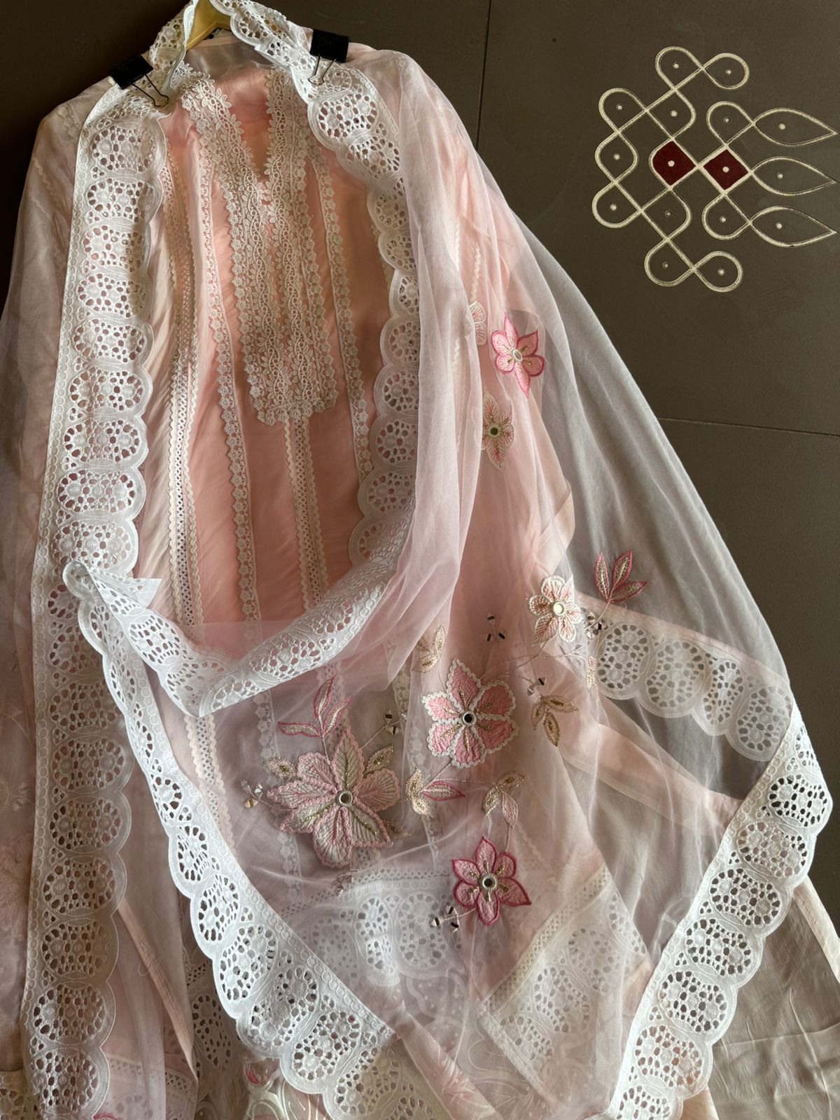 Soft organza unstitched suits with heavy crochia lace work detailings on the shirt