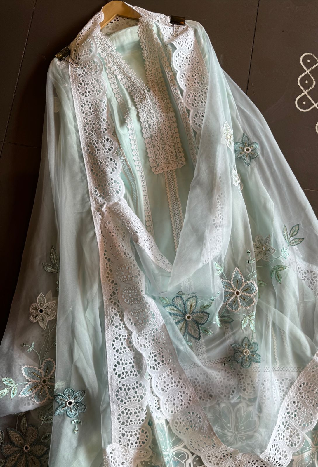 Soft organza unstitched suits with heavy crochia lace work detailings on the shirt