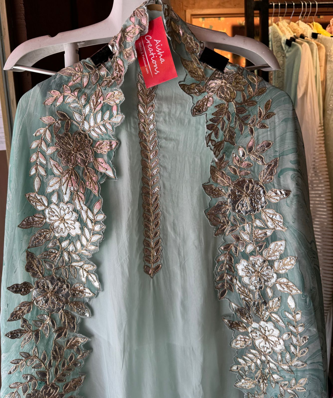 Plain shirt with neck Patti design and Cutwork done on the ghera of the shirt