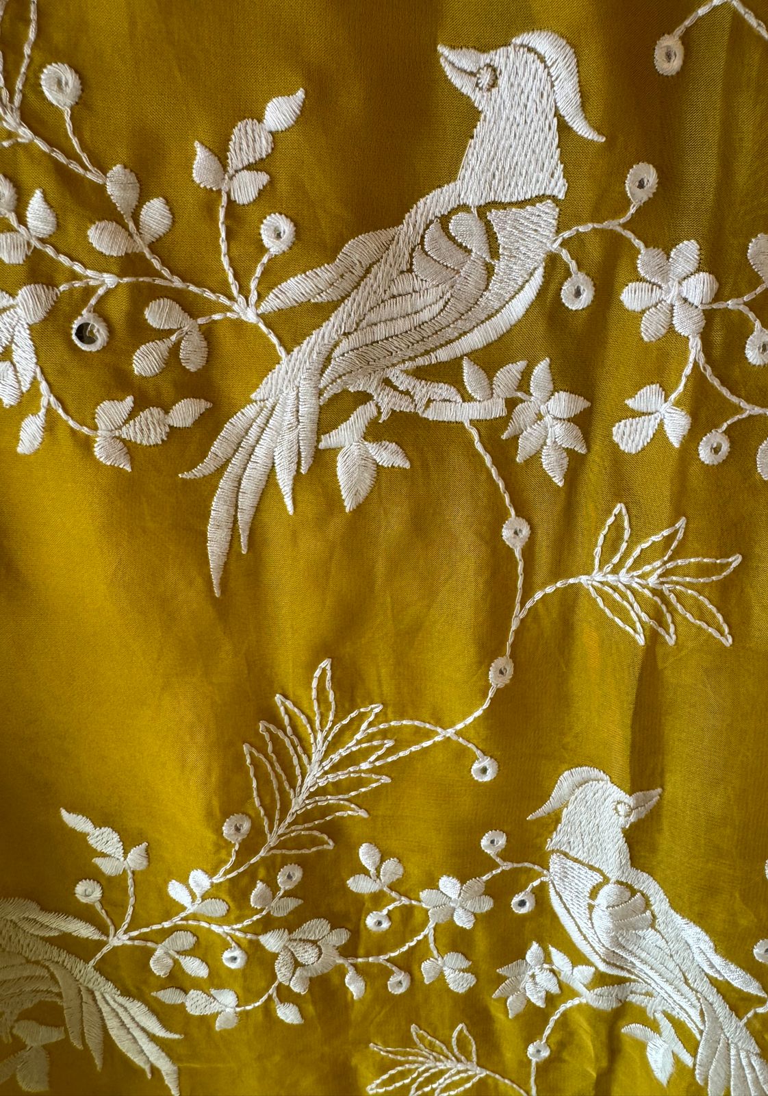 Very beautifully thread work done with sequence highlighting on the shirt front