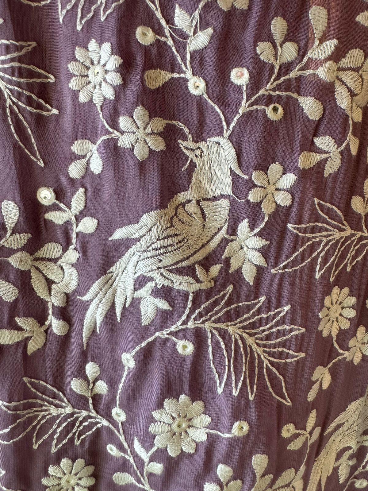 Very beautifully thread work done with sequence highlighting on the shirt front