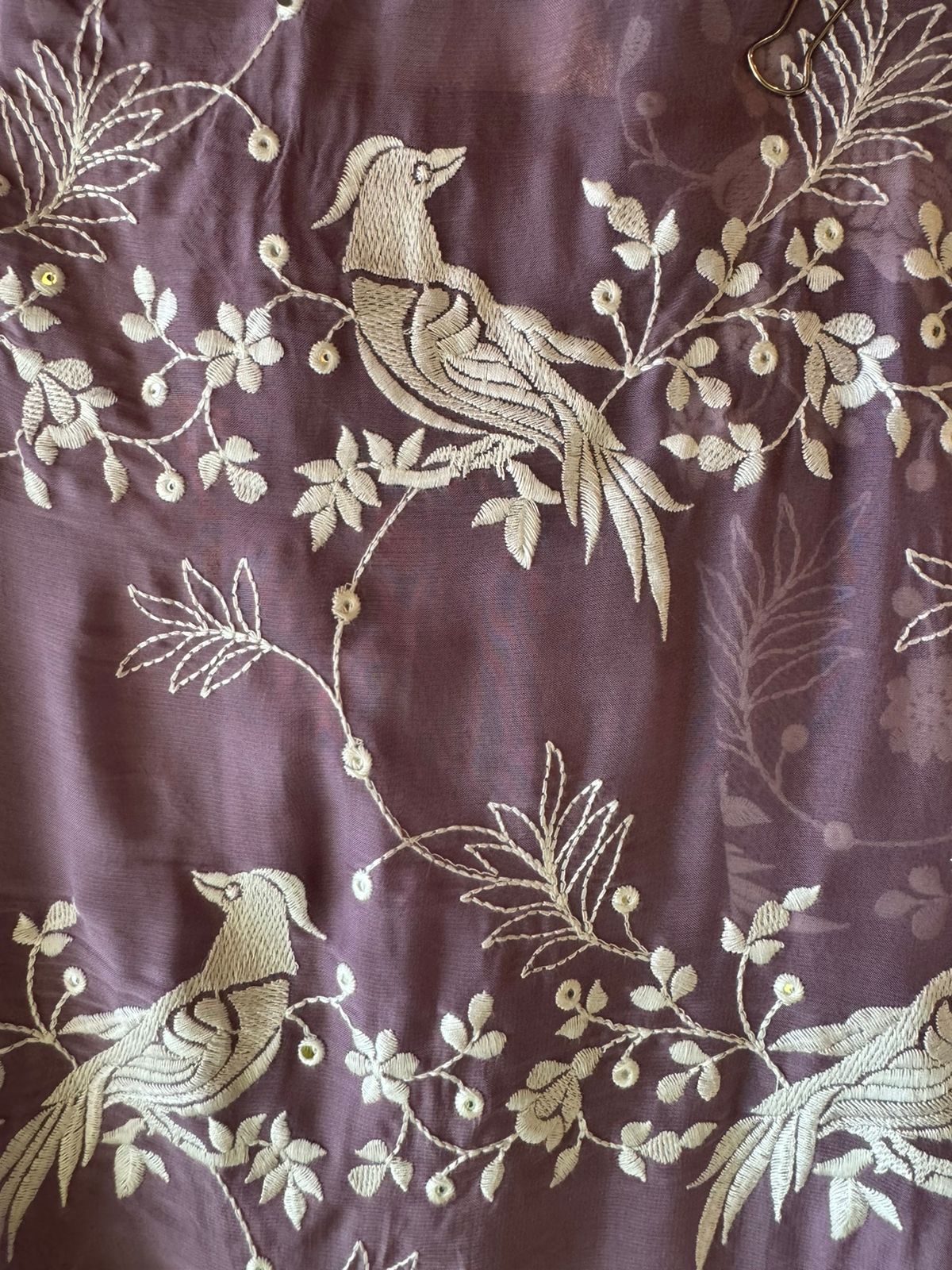 Very beautifully thread work done with sequence highlighting on the shirt front