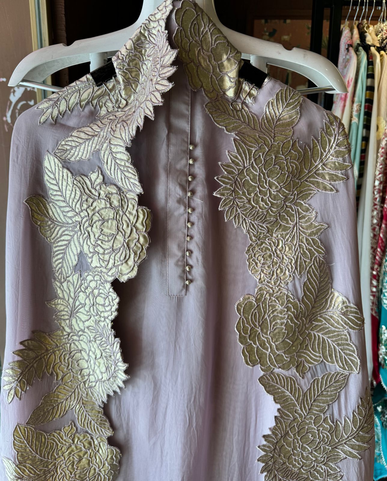 Super soft and Flowy organza with beautiful cushioning pattern on the shirt ghera and button detailings on the neckline