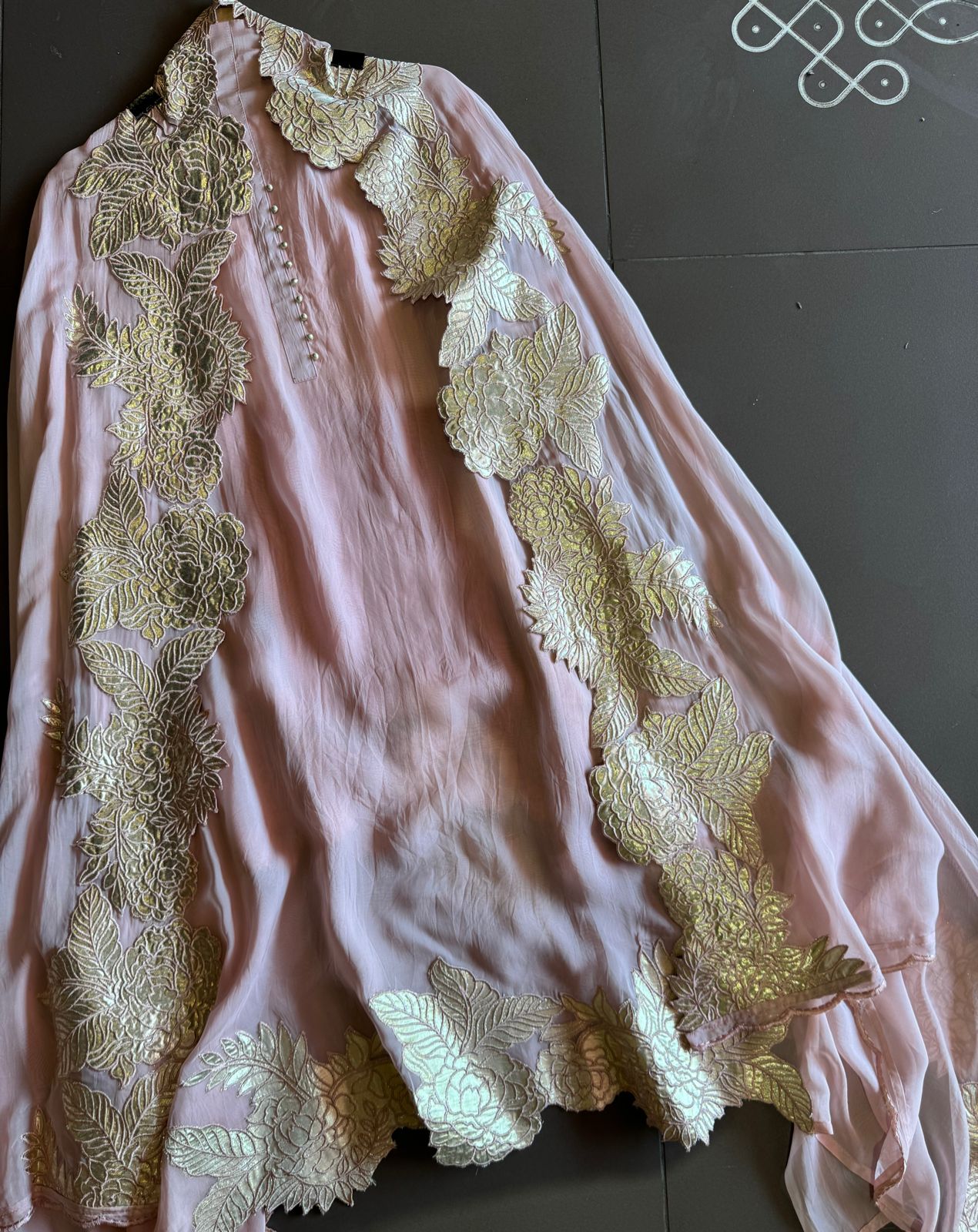 Super soft and Flowy organza with beautiful cushioning pattern on the shirt ghera and button detailings on the neckline