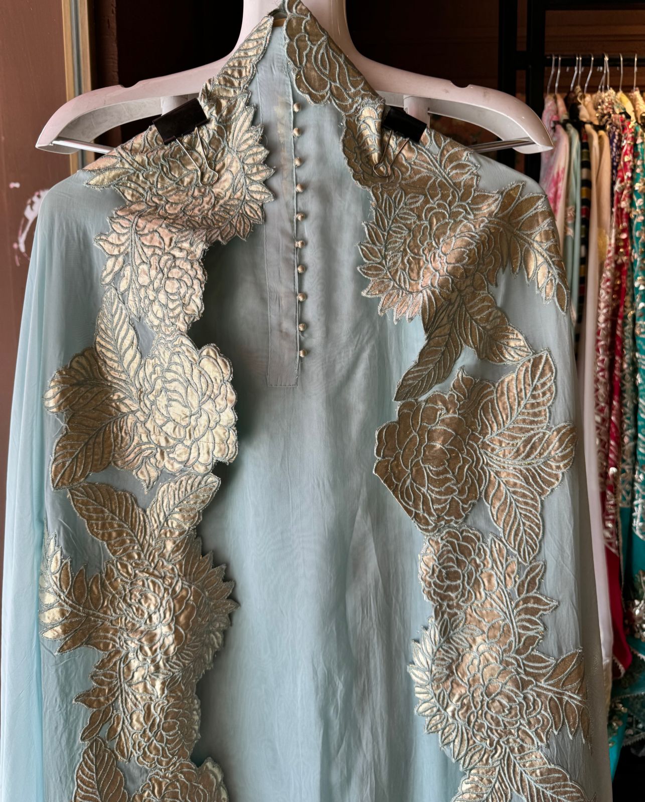 Super soft and Flowy organza with beautiful cushioning pattern on the shirt ghera and button detailings on the neckline