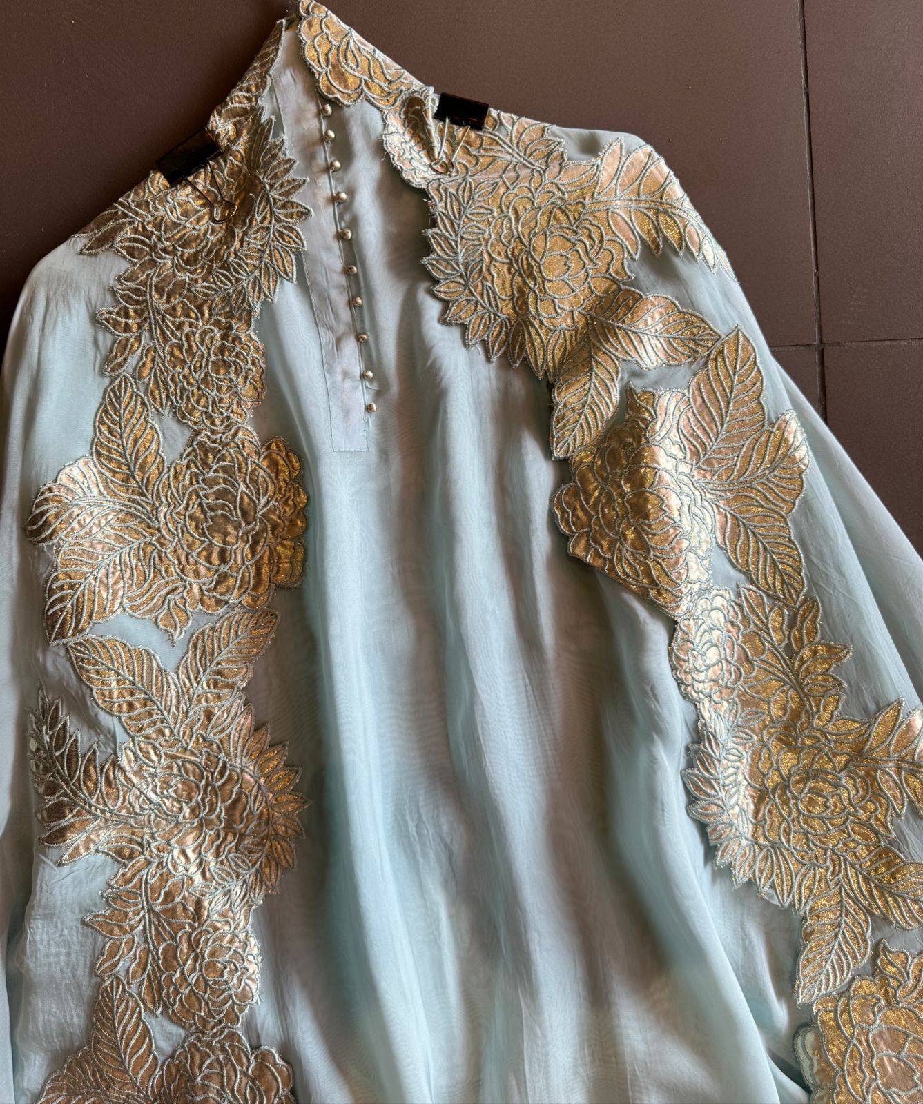 Super soft and Flowy organza with beautiful cushioning pattern on the shirt ghera and button detailings on the neckline