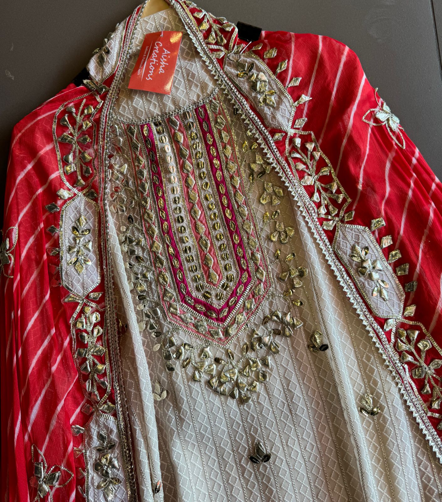 Pure Georgette Self embroidered shirt with heavy gotta Patti work done on the neckline