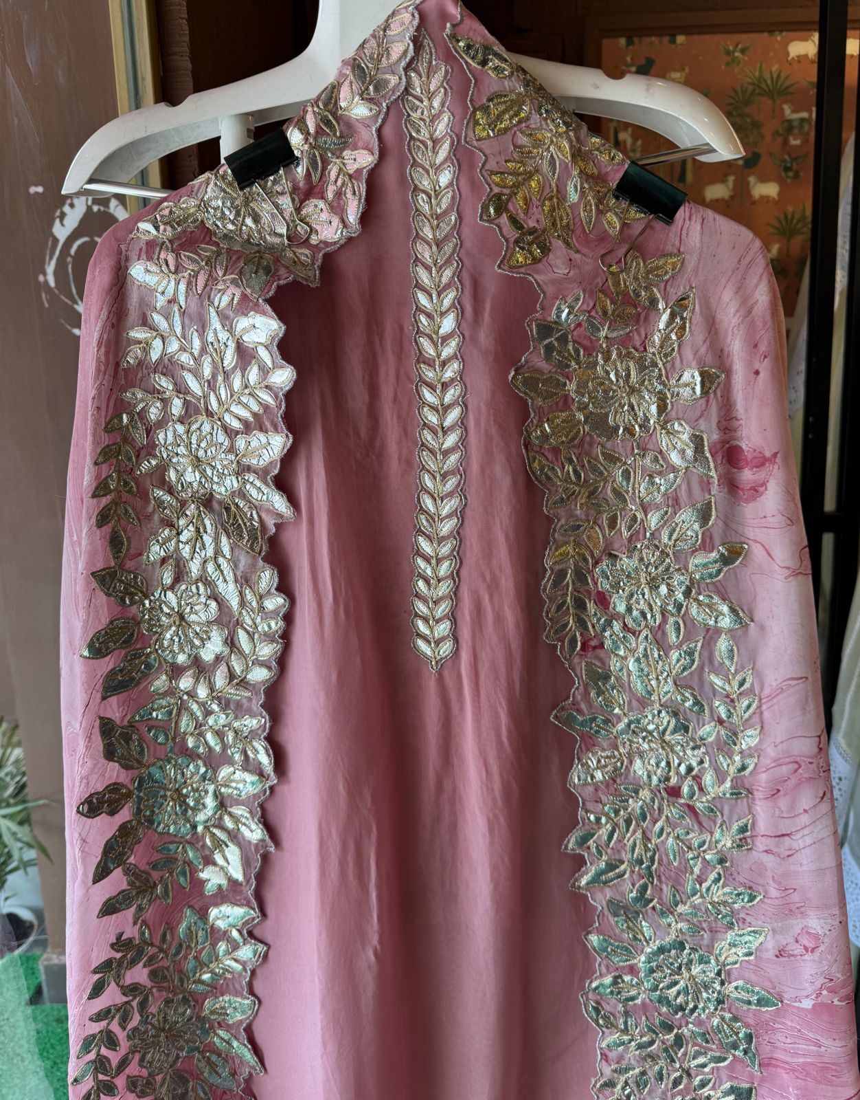 Plain shirt with neck Patti design and Cutwork done on the ghera of the shirt (Foil with dori work)