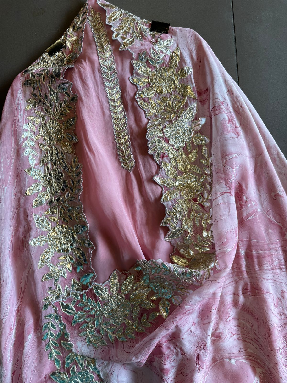 Plain shirt with neck Patti design and Cutwork done on the ghera of the shirt (Foil with dori work)