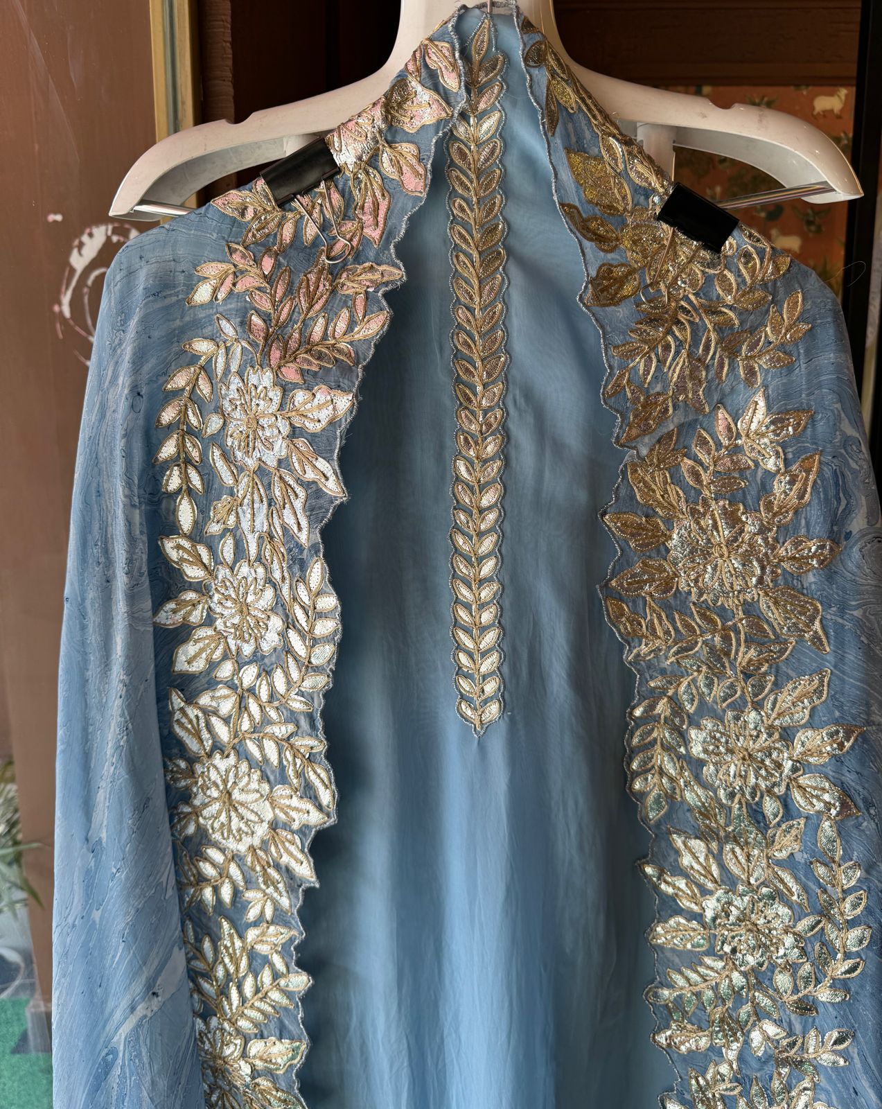 Plain shirt with neck Patti design and Cutwork done on the ghera of the shirt (Foil with dori work)