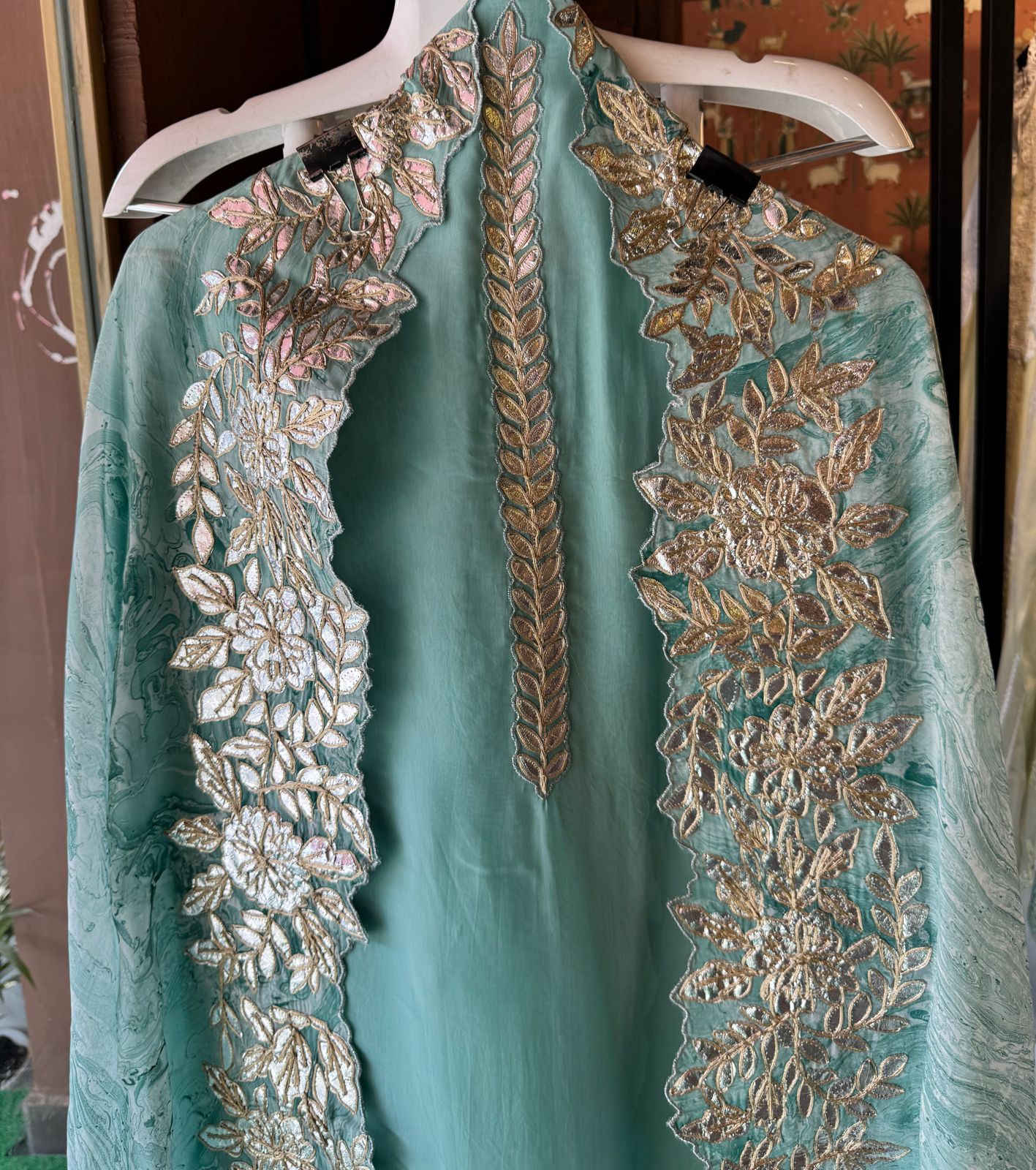 Plain shirt with neck Patti design and Cutwork done on the ghera of the shirt (Foil with dori work)