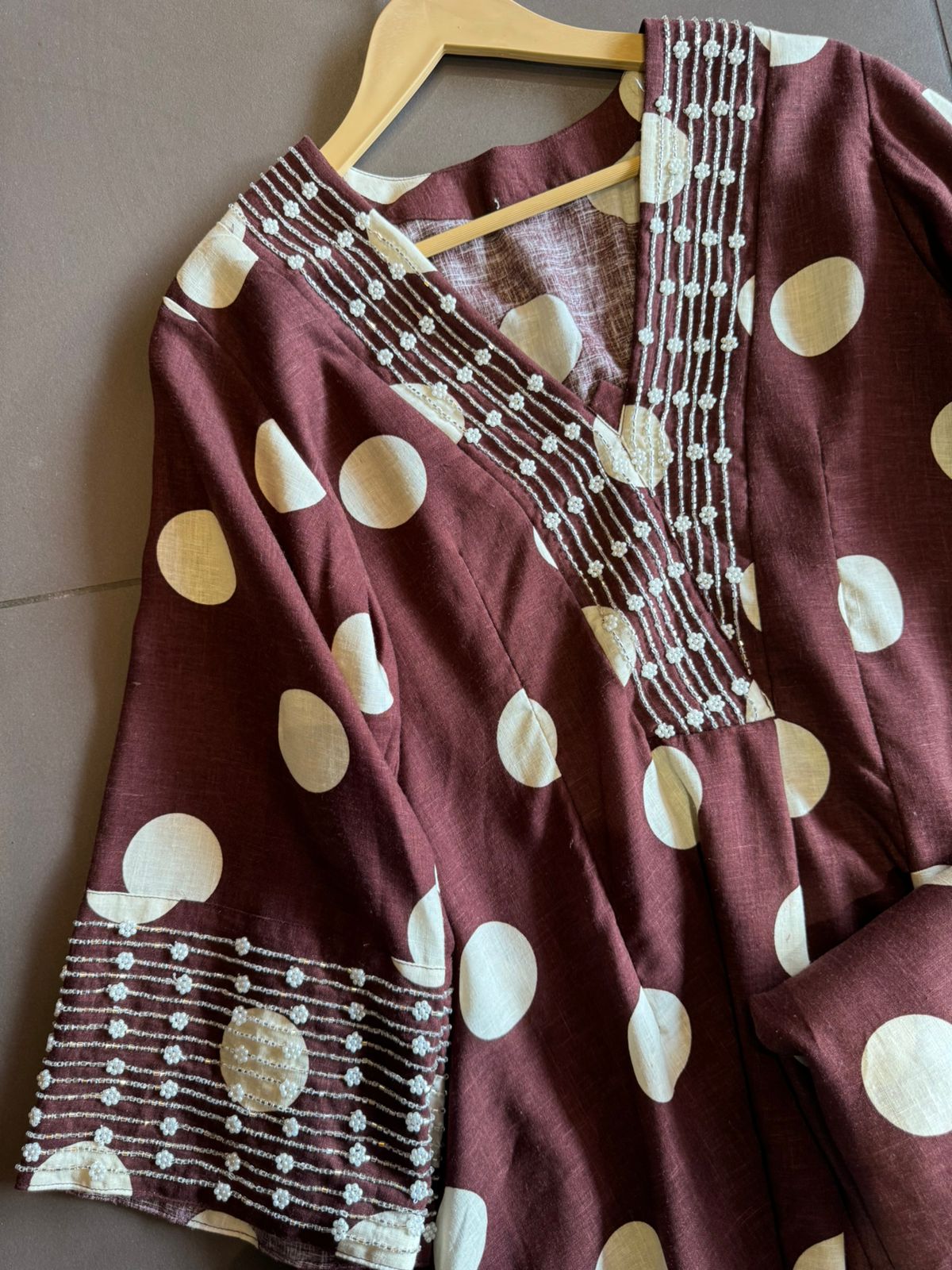 Pure linen cotton Polka dots set very smart and Elegant concept with nalki embellishments on the sleeves and neckline as well.