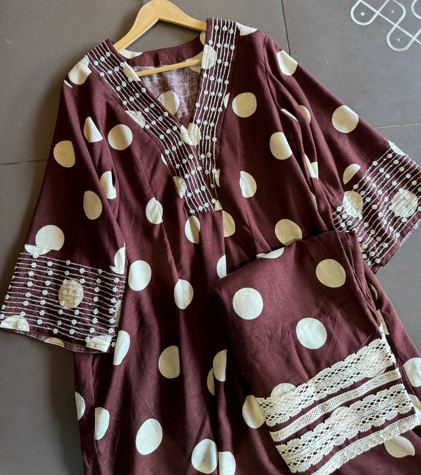 Pure linen cotton Polka dots set very smart and Elegant concept with nalki embellishments on the sleeves and neckline as well.