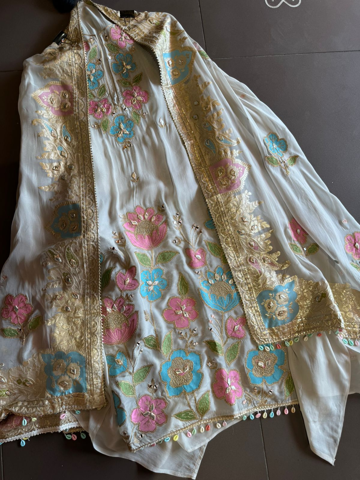 Soft organza Shirt unstitched Shirt with floral shimmer handcraft patchwork And zari Kadhai on it.