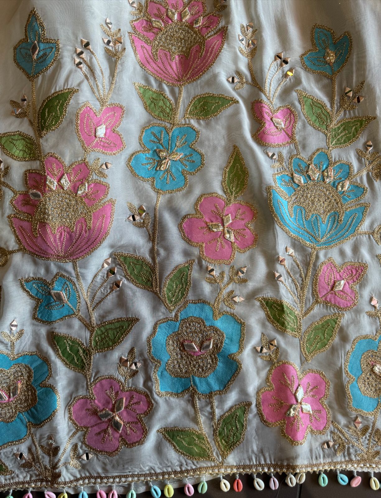 Soft organza Shirt unstitched Shirt with floral shimmer handcraft patchwork And zari Kadhai on it.