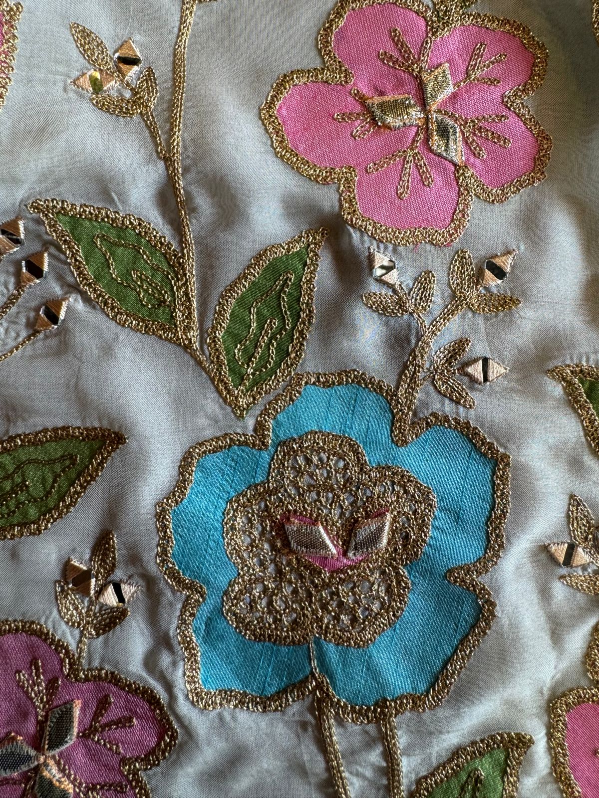 Soft organza Shirt unstitched Shirt with floral shimmer handcraft patchwork And zari Kadhai on it.