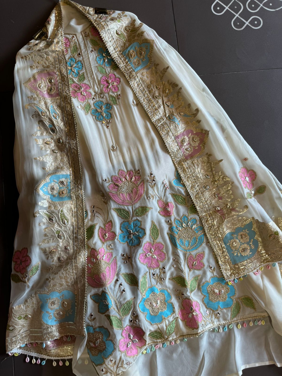 Soft organza Shirt unstitched Shirt with floral shimmer handcraft patchwork And zari Kadhai on it.