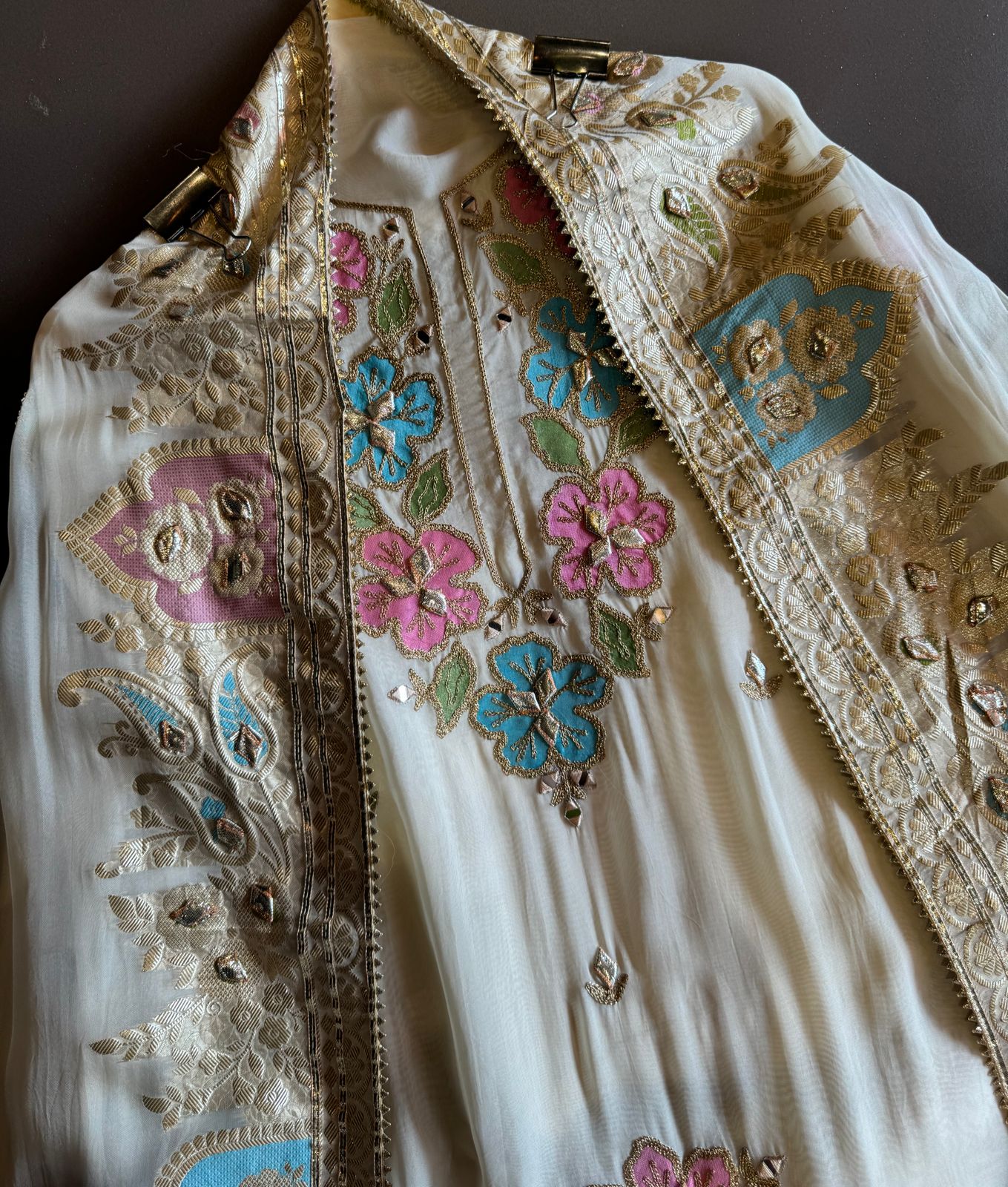 Soft organza Shirt unstitched Shirt with floral shimmer handcraft patchwork And zari Kadhai on it.