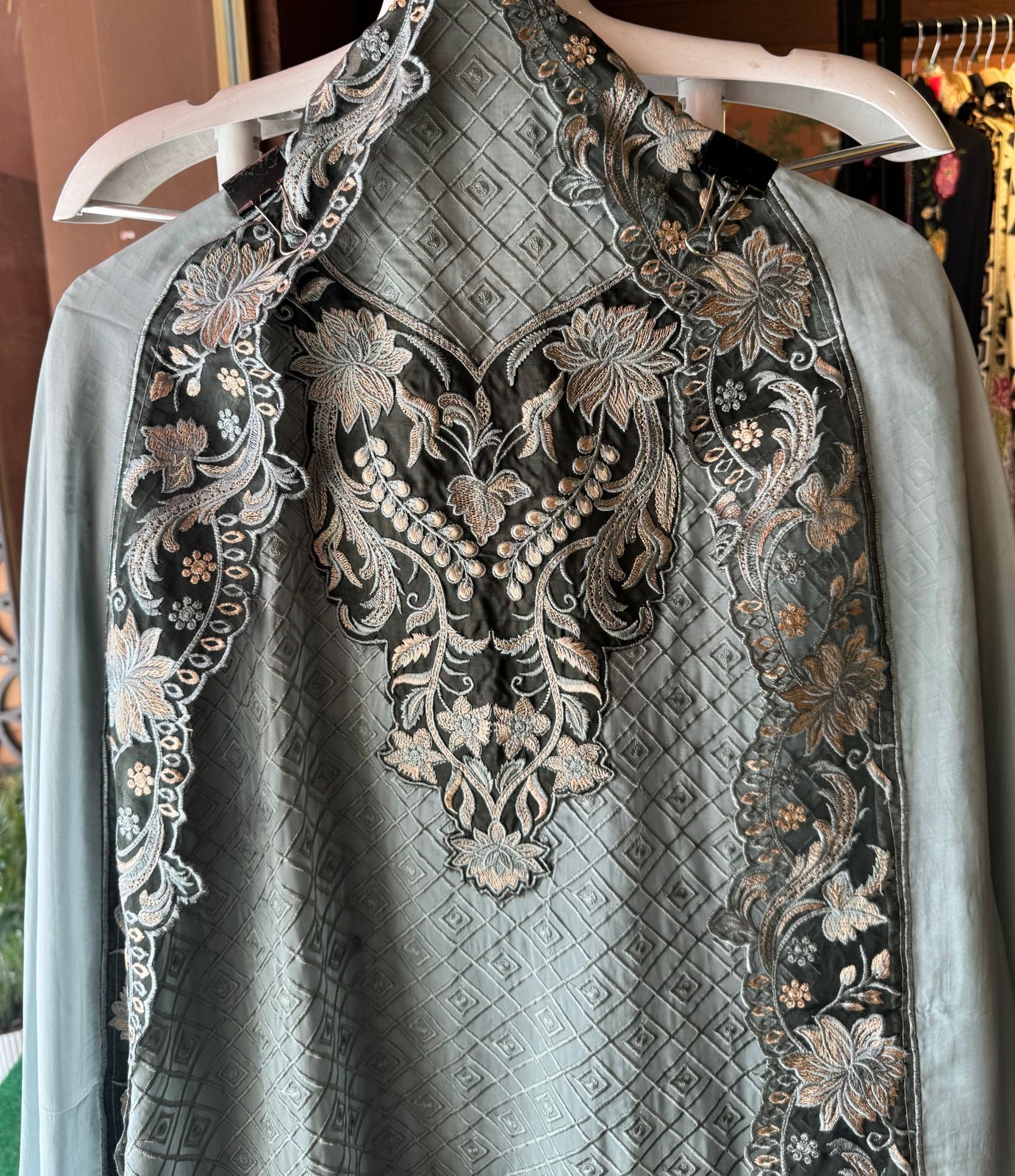 Soft organza self embroidered base with embroidered patchwork on the neckline with designer ghera and lacework done