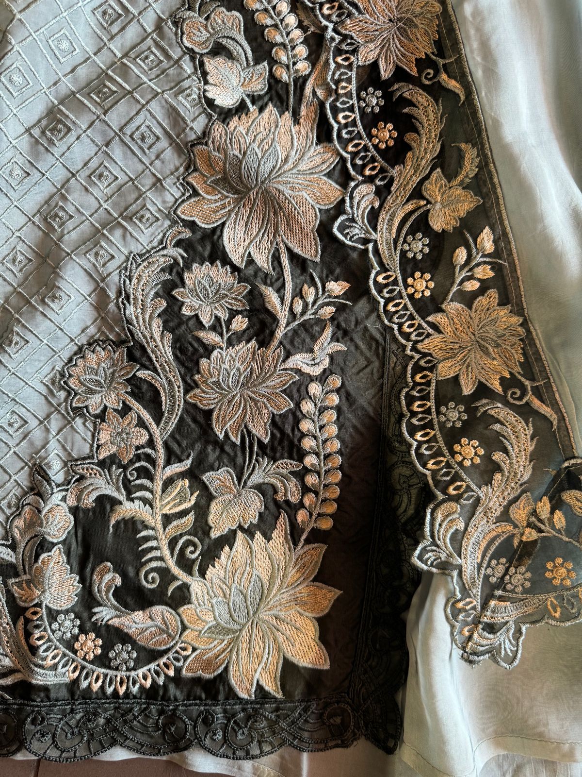 Soft organza self embroidered base with embroidered patchwork on the neckline with designer ghera and lacework done