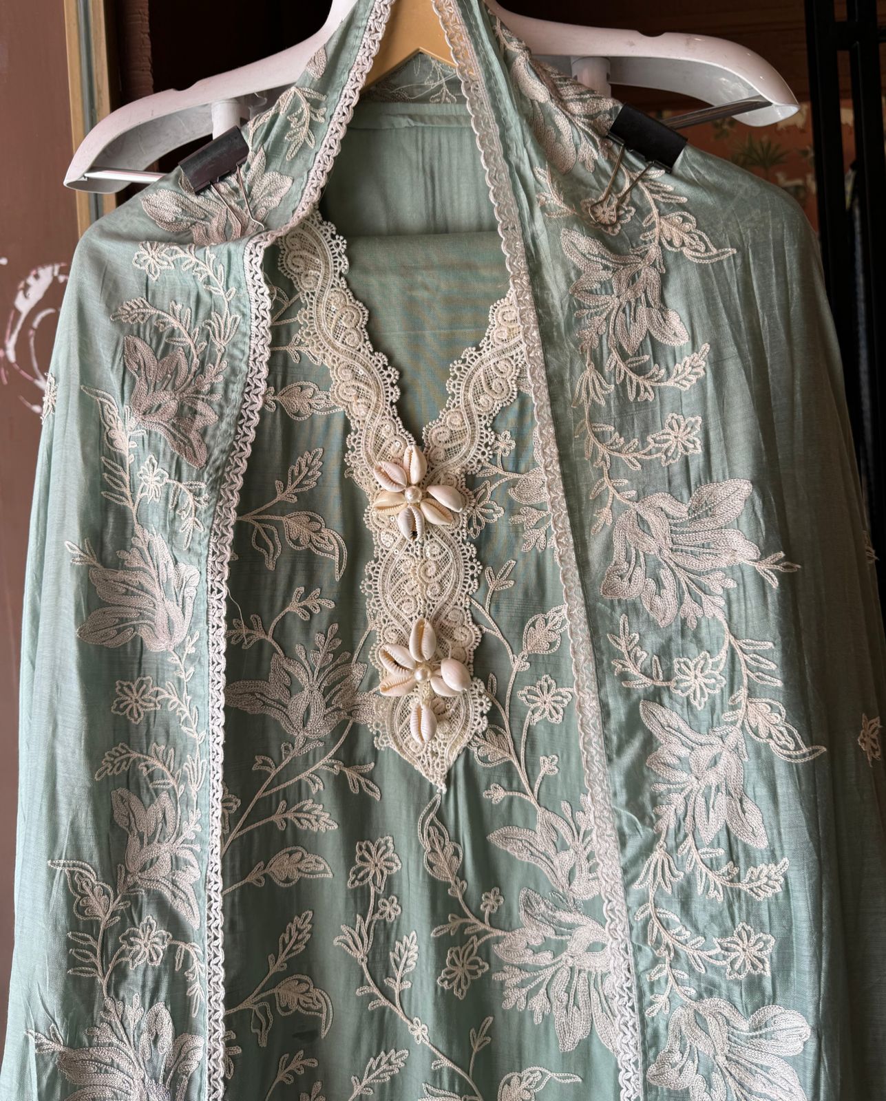 Soft linen cotton shirt (Unstitched)with crochia lace neck detailings with original shankh attached on the neckline